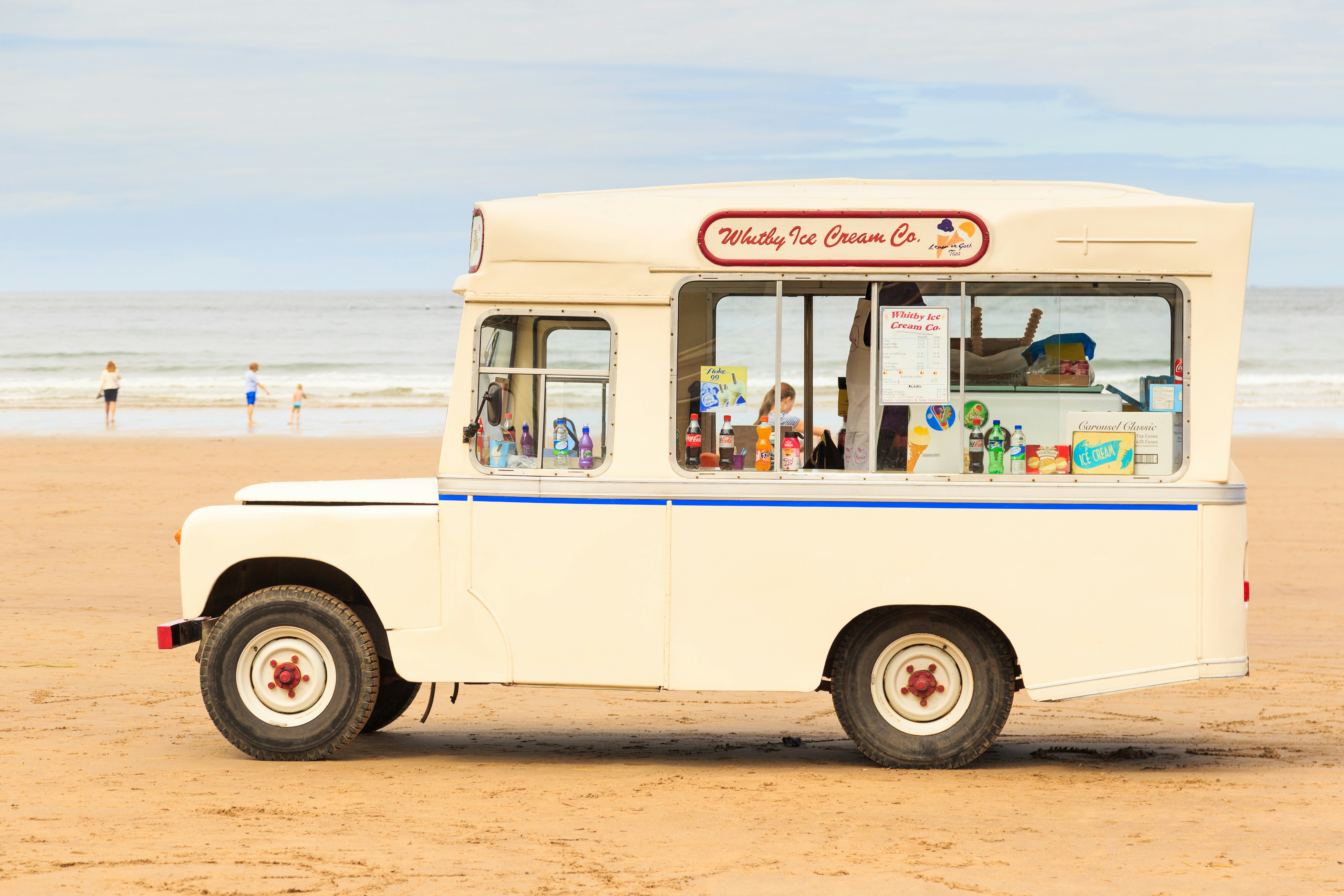 A traditional ice cream van on the beach in Whitby, North Yorkshire, England.