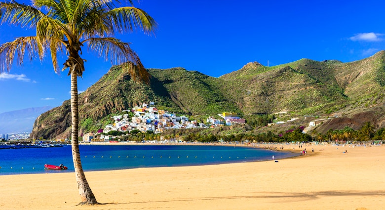 The large sandy stretch of Playa de las Teresitas under clear blue sky.
795611044
san andreas, canarian, medano, tejita, teneriffa, bay, beach, beautiful, blue, canary, coast, colorful, exotic, holiday, idyllic, island, landmark, landscape, las, mountain, nature, ocean, palms, panorama, paradise, place, playa, popular, resort, sand, santa cruz, scene, scenic, sea, spain, spanish, summer, sun, tenerife, tourism, tourist, town, travel, tropical, vacation, view, village, volcanic, water, yellow