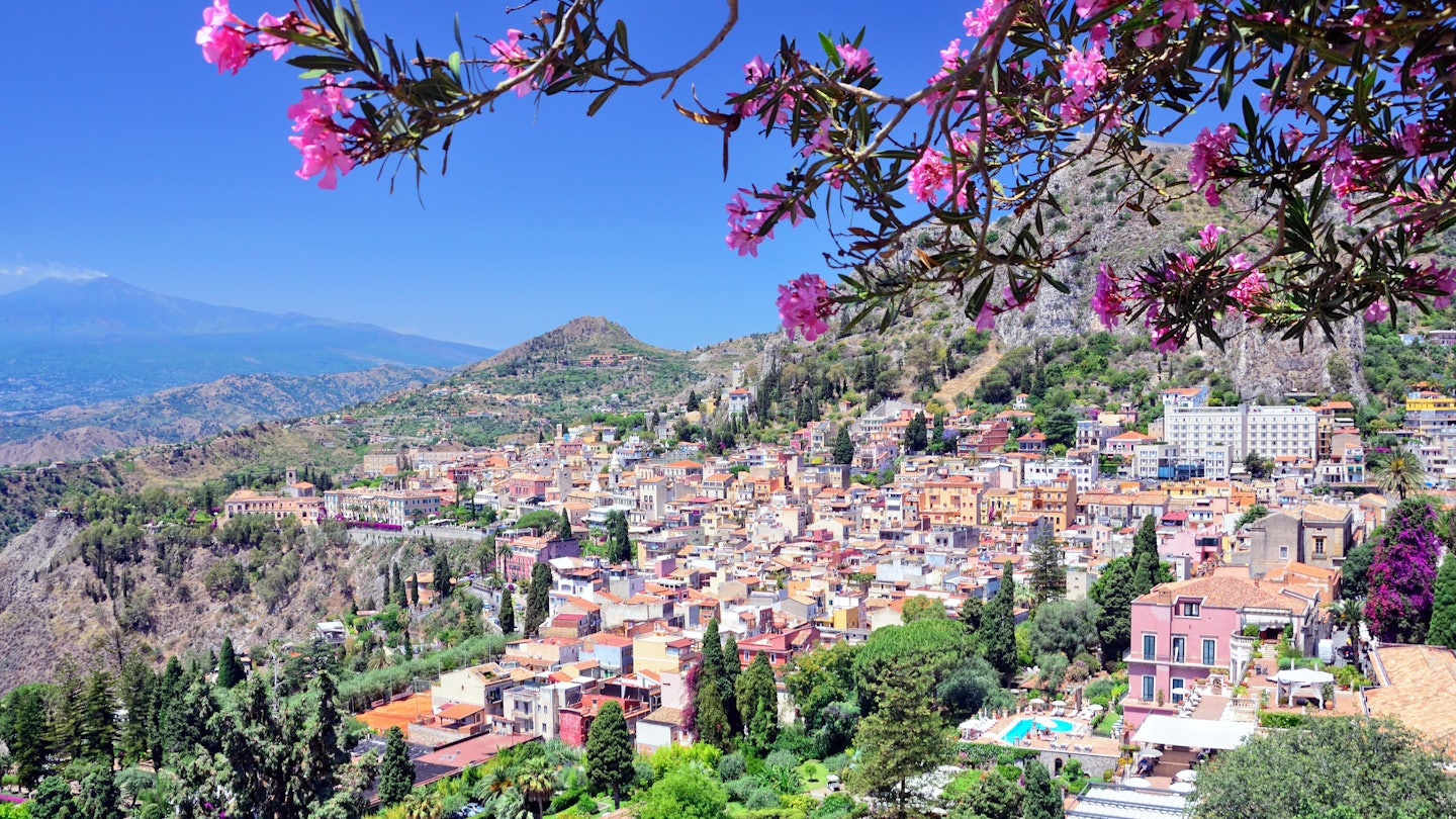 Taormina town with Mount Etna on background