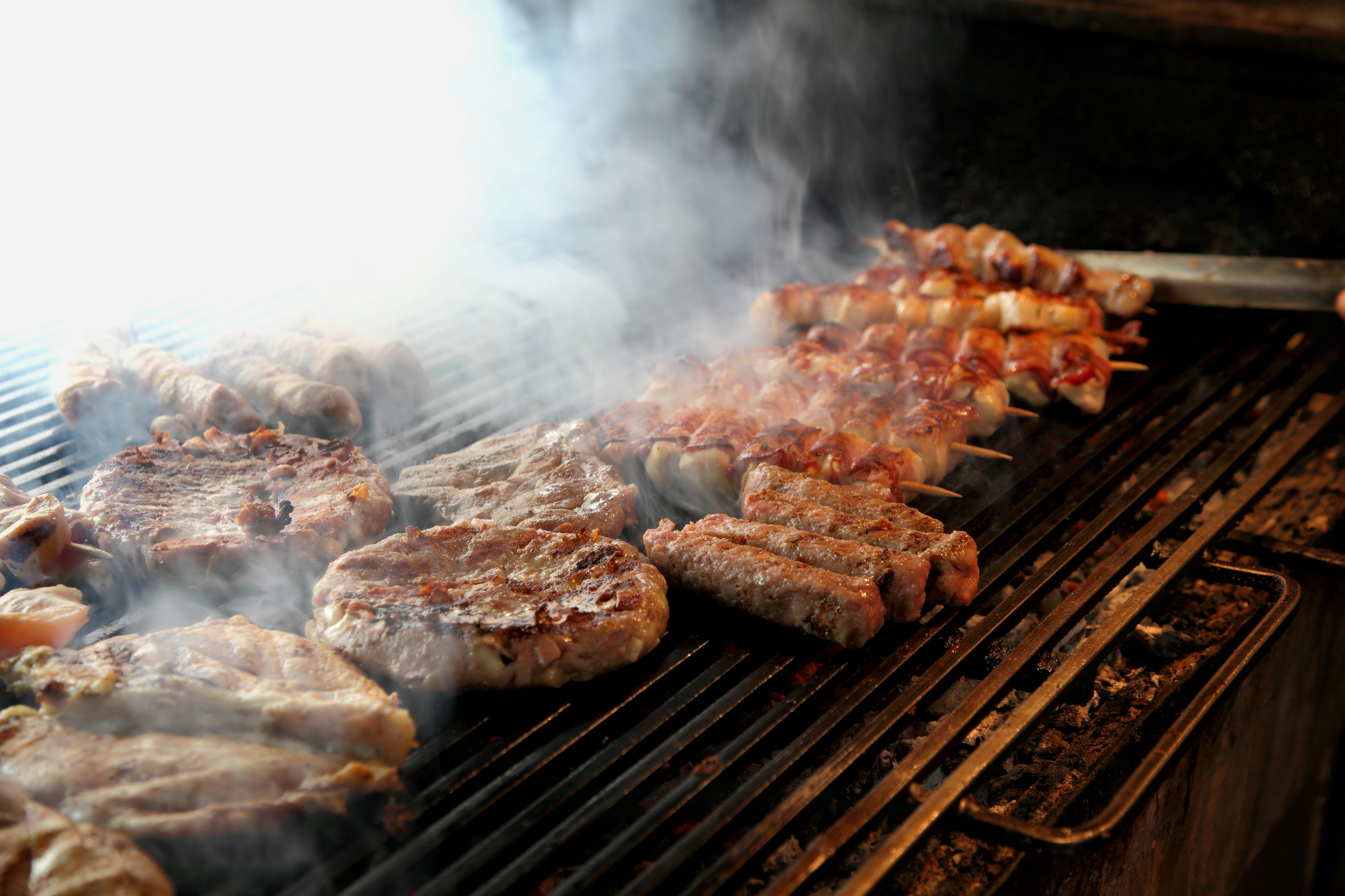 Meat kebabs on a grill.