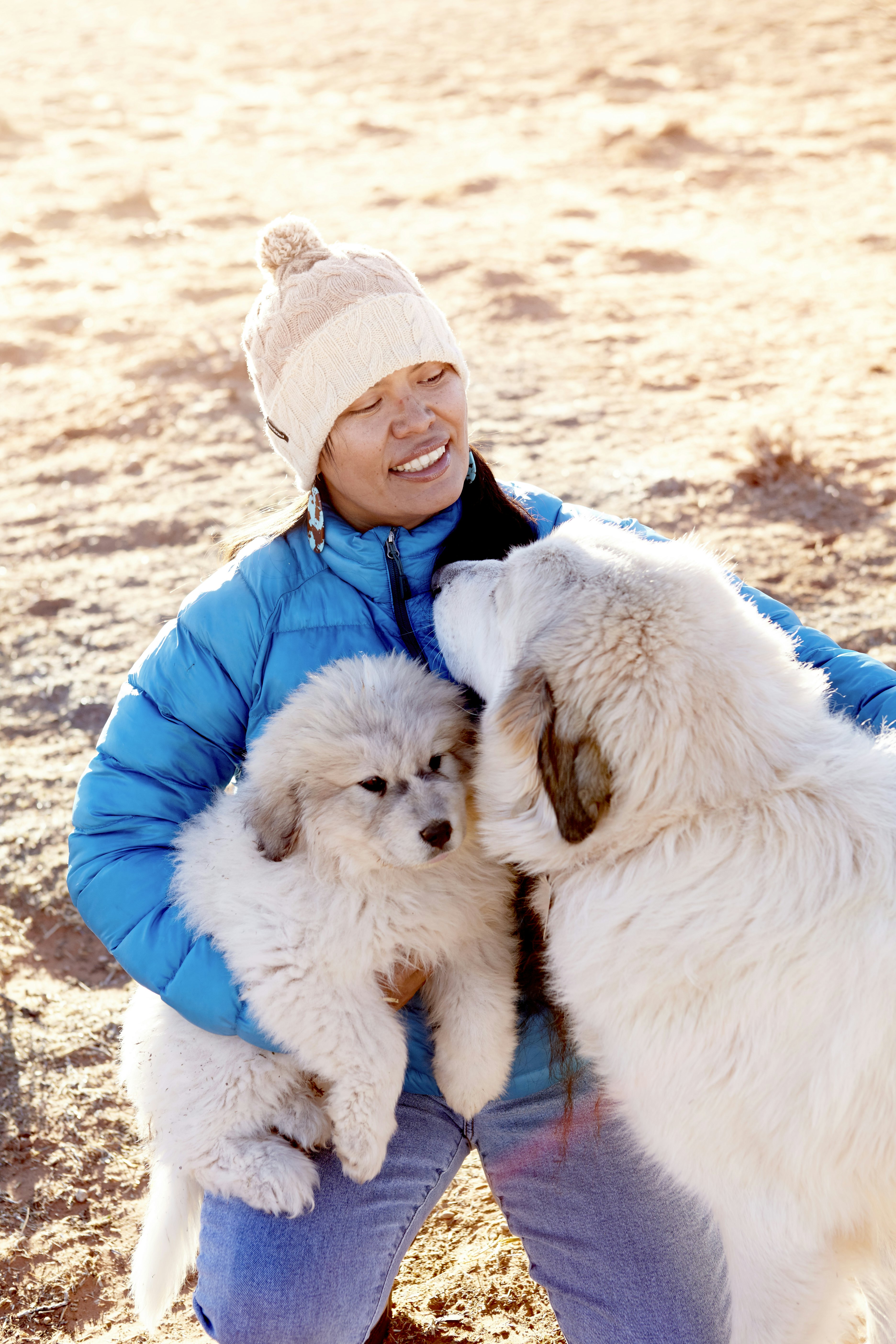 Navajo woman with sheep dogs in Navajo Nation near Page.