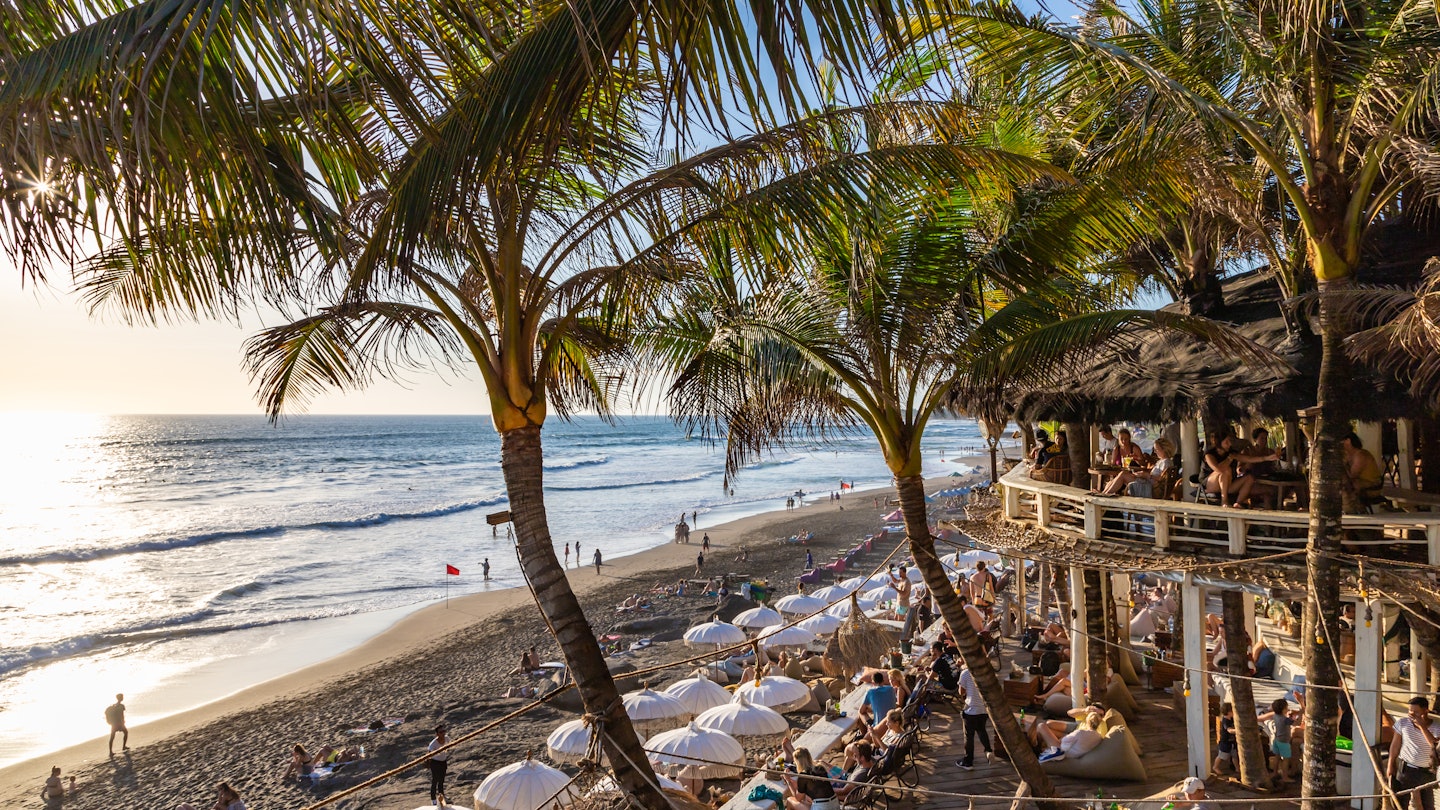 CANGGU, BALI / INDONESIA - NOVEMBER 5, 2019: View on a beautiful beach restaurant terrace La Brisa crowded with tourists at the famous Echo Beach at sunset License Type: media Download Time: 2024-03-18T03:20:42.000Z User: mvm_lonelyplanet Is Editorial: Yes purchase_order: