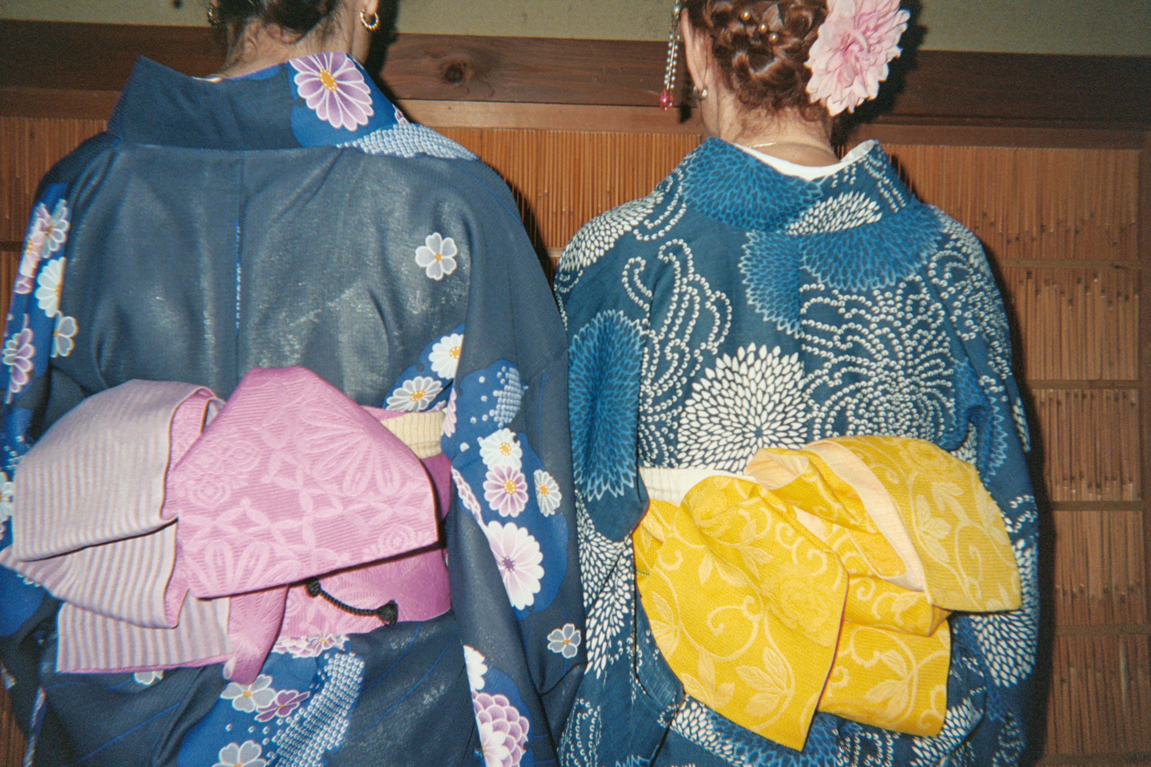 Two women dressed in traditional kimonos for a tea ceremony in Japan