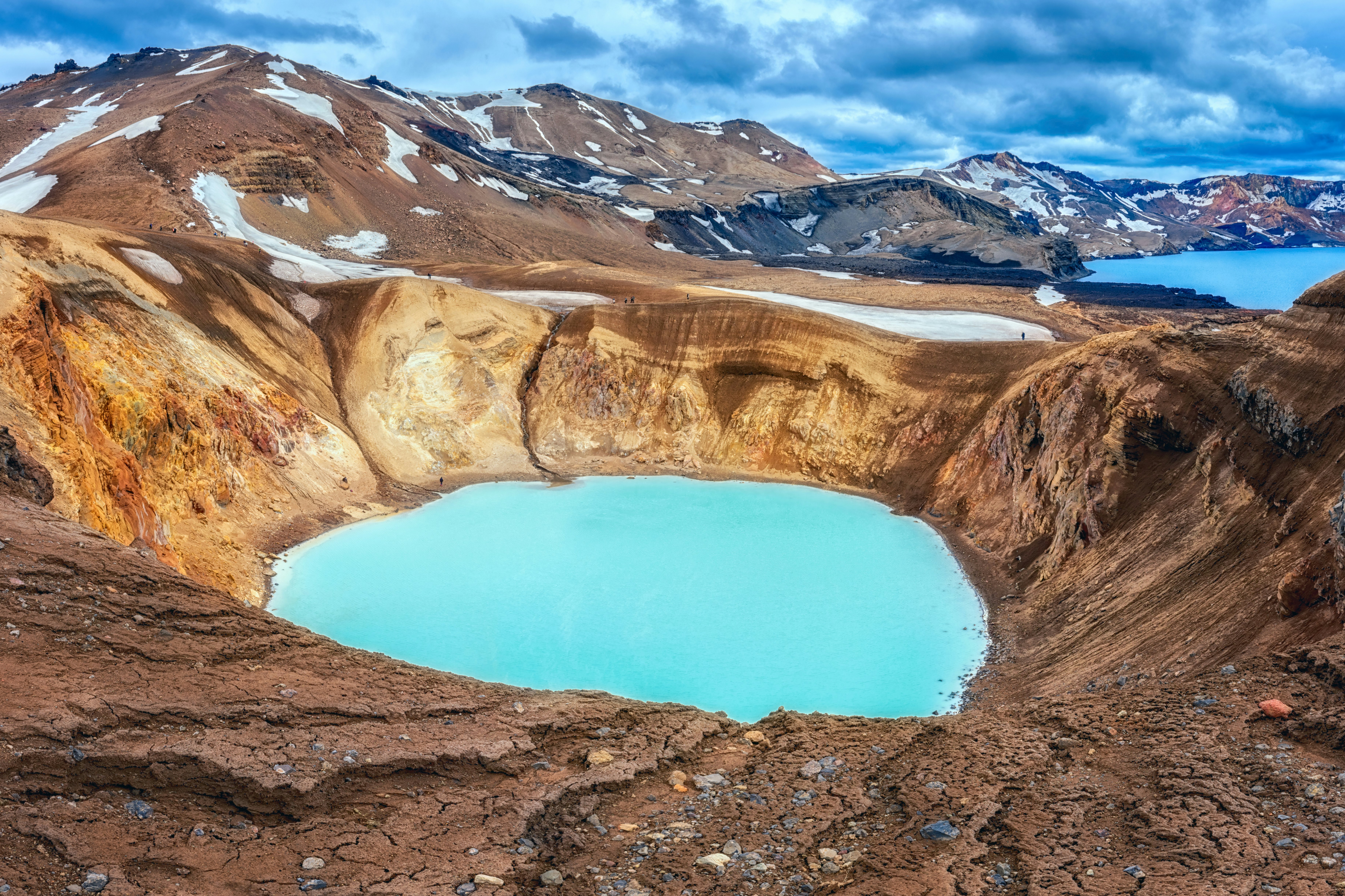 An aqua blue lake in a rocky landscape in Iceland.