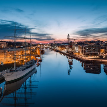 Aerial view of calm aurojoki river and Swan of Finland sailing ship at dawn in Turku, Finland, License Type: media, Download Time: 2025-08-26T17:30:04.000Z, User: bhealy950, Editorial: false, purchase_order: 65050 - Digital Destinations and Articles, job: Lonely Planet Online Editorial, client: Best things to do in Turku, other: Brian Healy