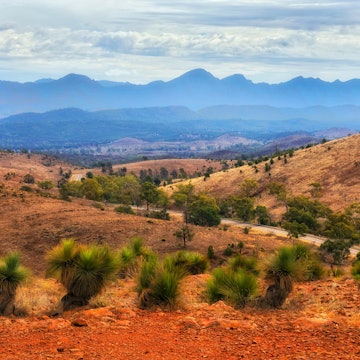 Hucks lookout in Flinders Ranges national park of South Australia to Wilpena Pount rock formation at sunset.; Shutterstock ID 2447536287; purchase_order:65050 - Digital Destinations and Articles; job:Online editorial; client:South Australia guide; other:Claire Naylor
2447536287