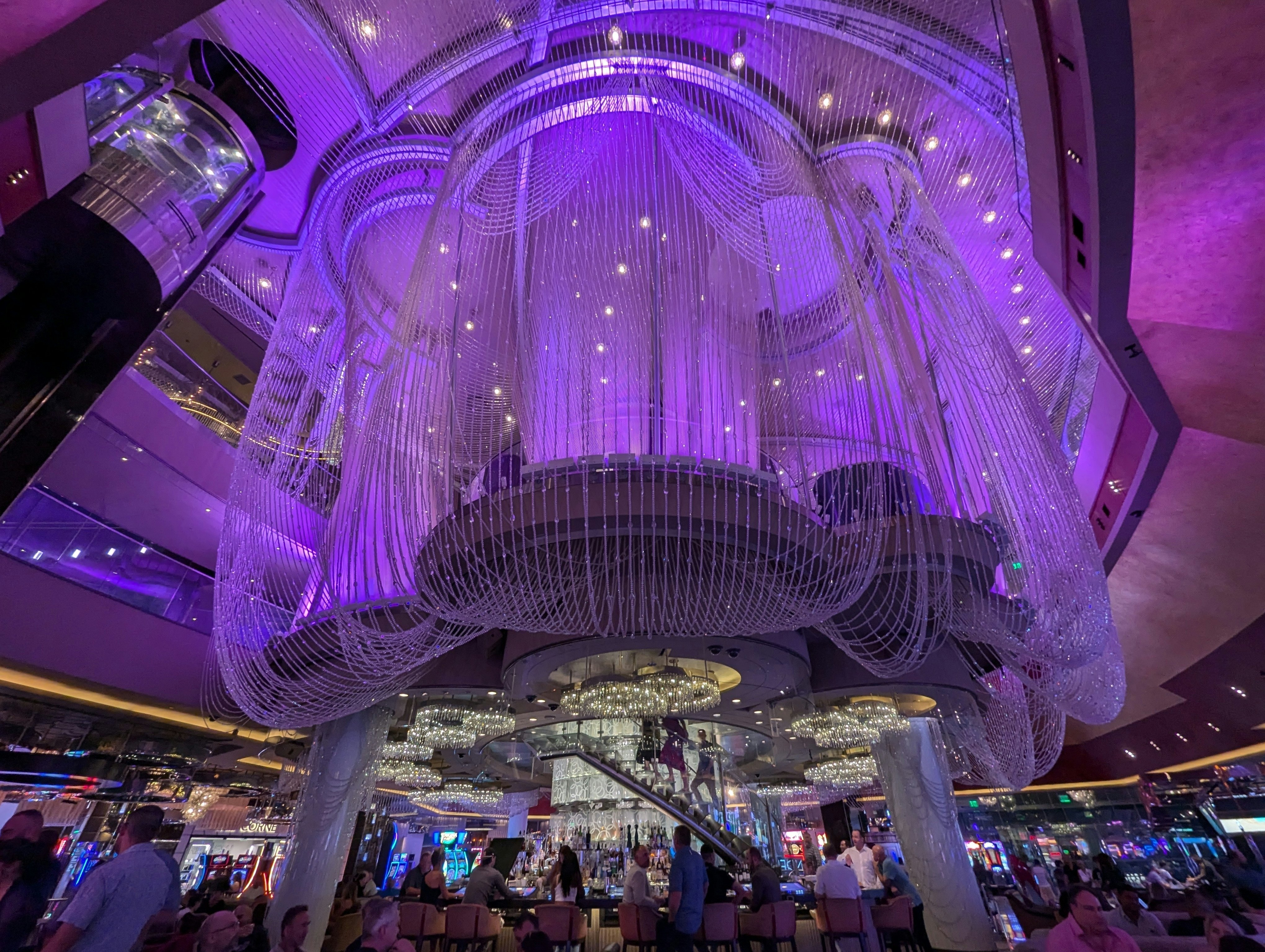 The Chandelier Bar at the Cosmopolitan Hotel in Las Vegas is surrounded by a beaded curtain with lilac.