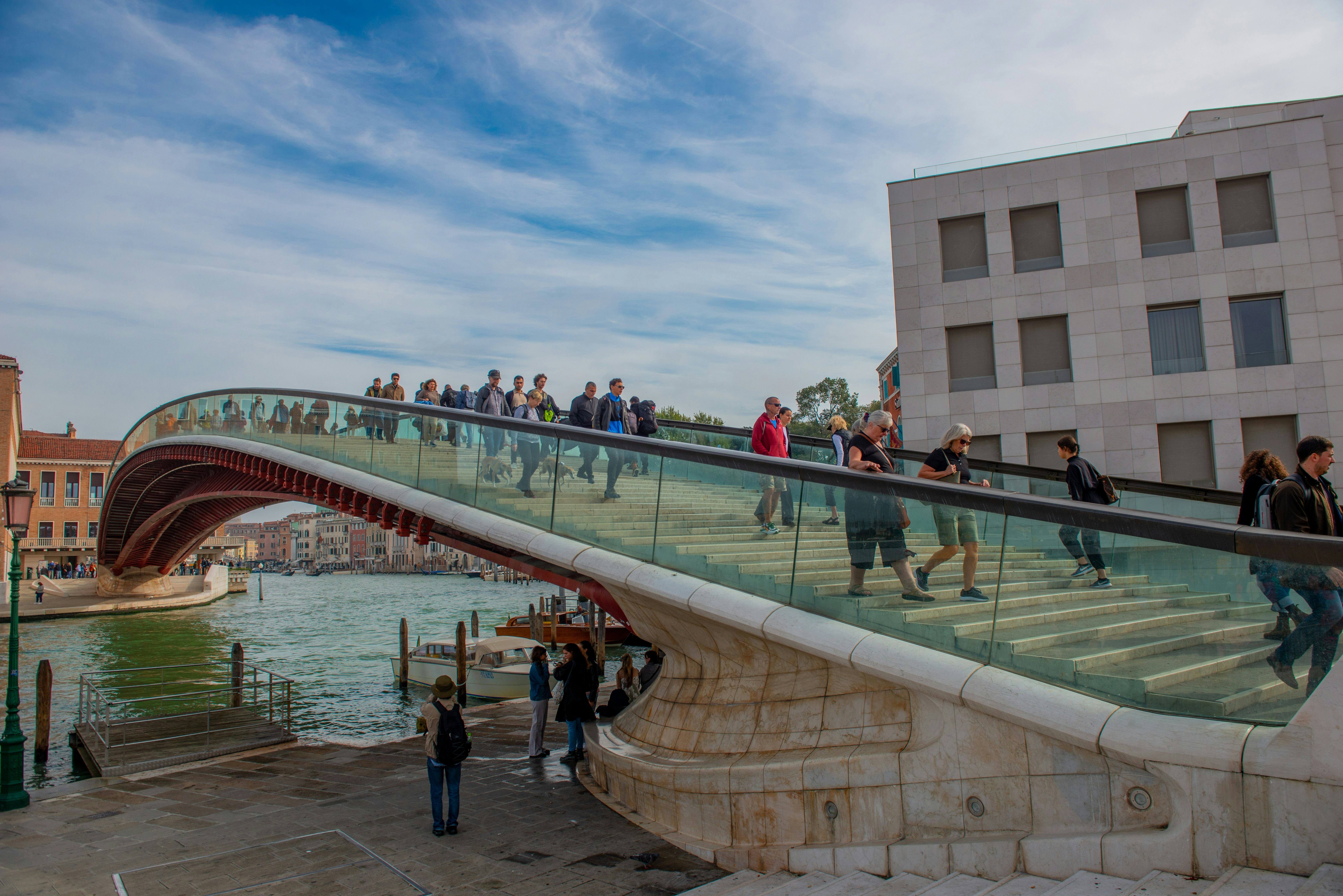 People crossing the Grand Canal in Venice via a pedestrian bridge between Piazzale Roma and the Santa Lucia train station.