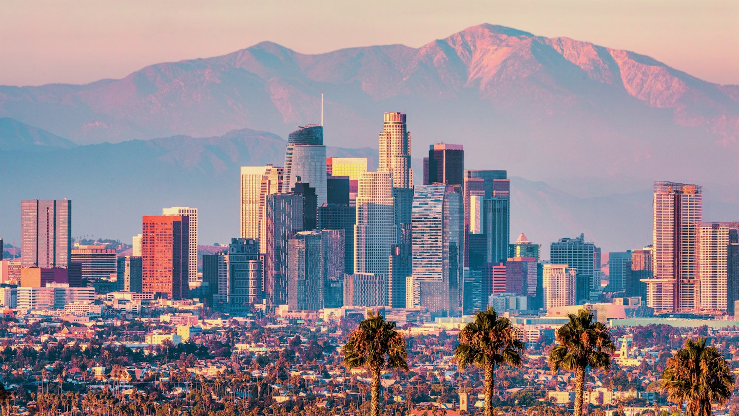 Downtown Los Angeles at sunset. Beautiful view of the city with the San Gabriel Mountains in the background. Concept, Hollywood, Tourism, Cinema, Stars, Celebrities, License Type: media, Download Time: 2025-08-04T20:29:27.000Z, User: meg3348277, Editorial: false, purchase_order: 56530 - Guidebooks, job: Global Publishing-WIP, client: Lonely Planet 'California 11, other: Megan Cassidy