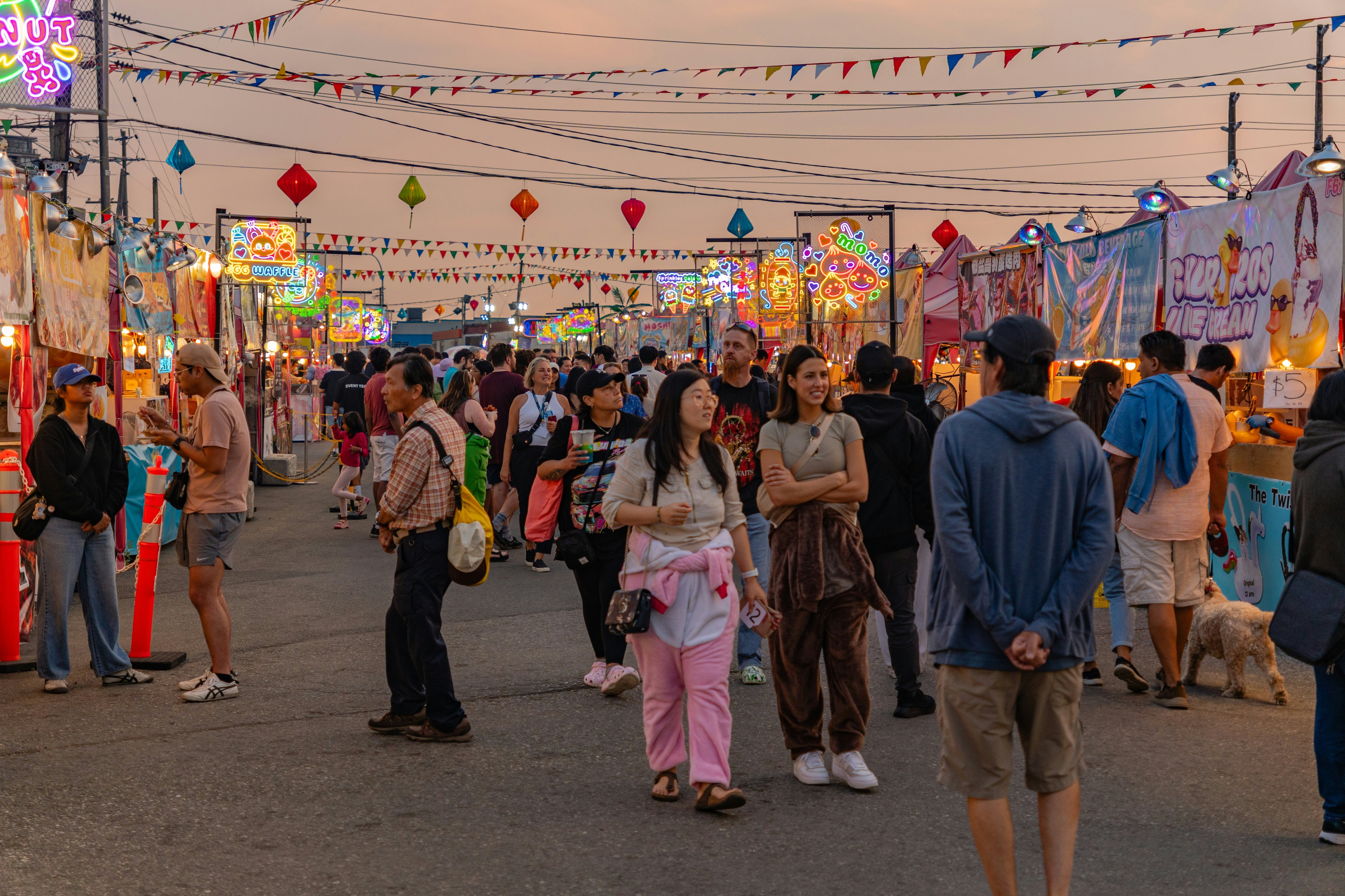 People walking around the local Asian night market in Richmond, Vancouver, BC, Canada
