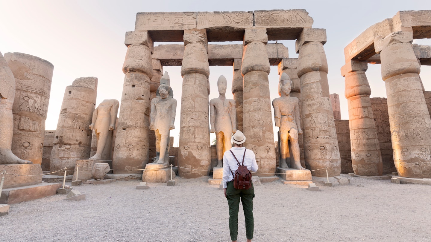 Woman tourist at Luxor Temple at sunset, Luxor, Egypt, License Type: media, Download Time: 2025-07-02T19:16:52.000Z, User: dermothegarty77, Editorial: false, purchase_order: 56530 - Guidebooks, job: Global Publishing WIP, client: Egypt-16, other: Dermot Hegarty