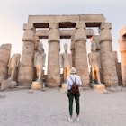 Woman tourist at Luxor Temple at sunset, Luxor, Egypt, License Type: media, Download Time: 2025-07-02T19:16:52.000Z, User: dermothegarty77, Editorial: false, purchase_order: 56530 - Guidebooks, job: Global Publishing WIP, client: Egypt-16, other: Dermot Hegarty