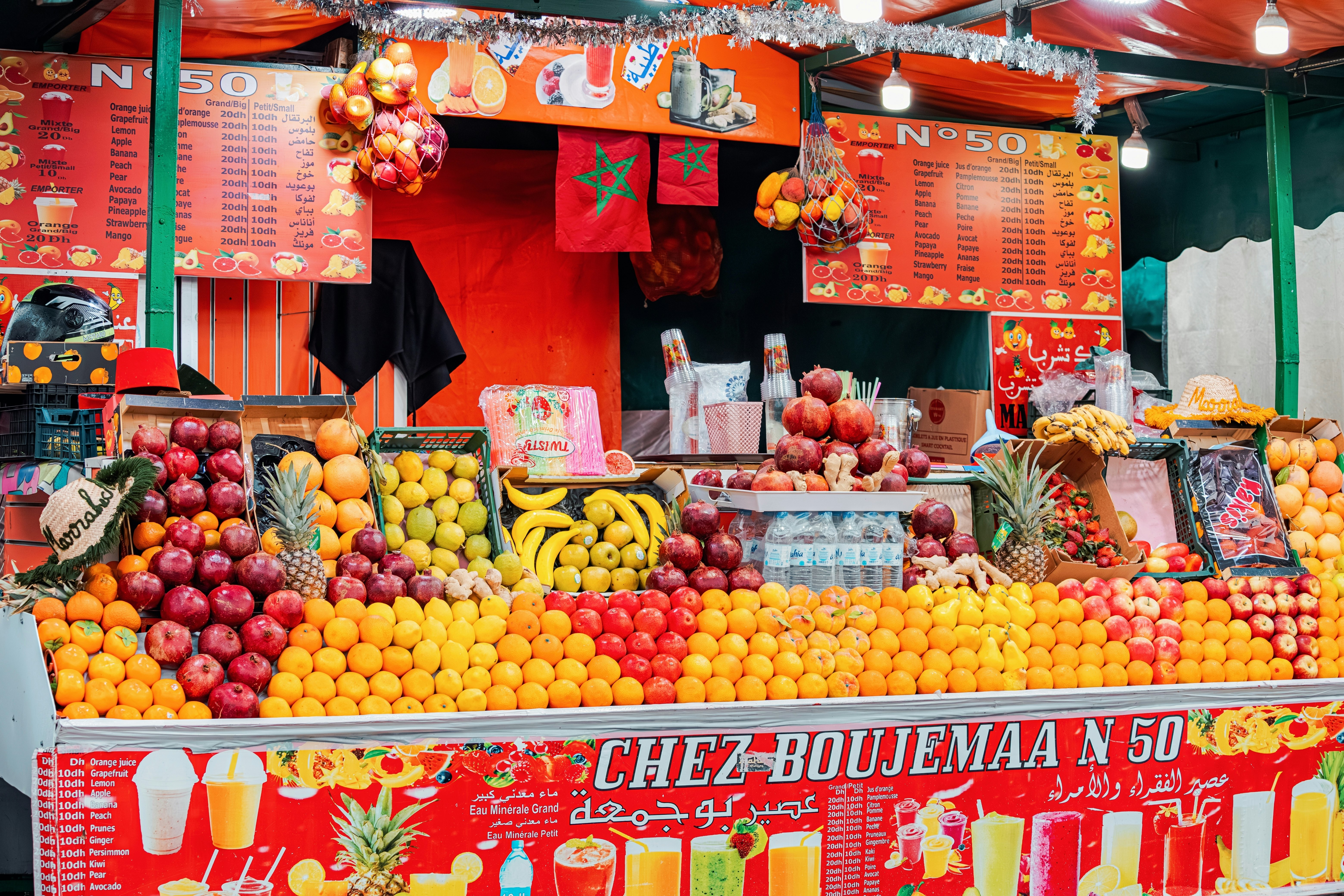 Vibrant display of various fruits at a Djembe El Fna market stall, showcasing the variety of local produce,
