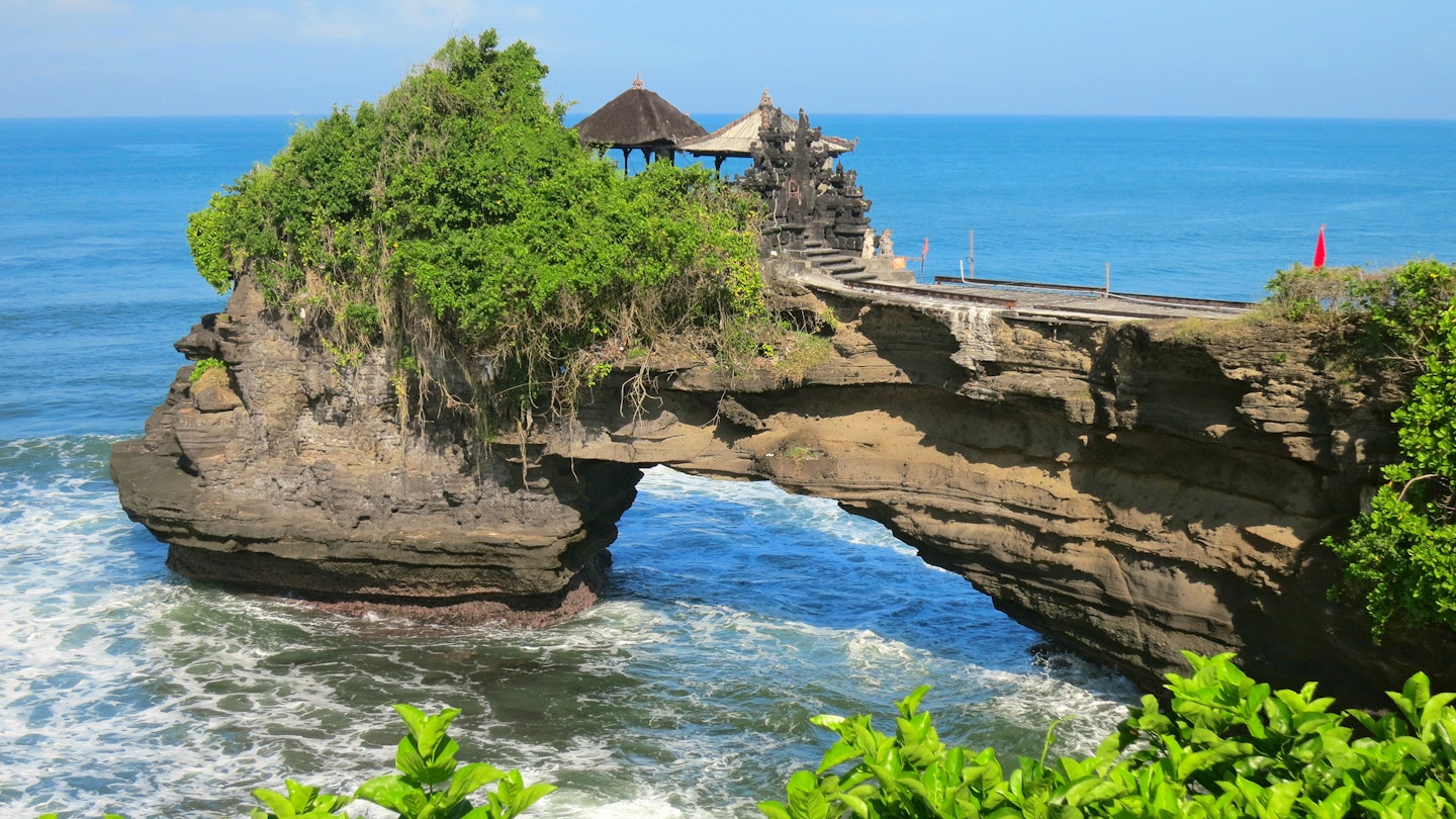 Ocean rock with hole near Pura Batu Bolong temple, Bali, Indonesia, License Type: media, Download Time: 2025-05-29T14:38:27.000Z, User: lonelyplanetmedia, Editorial: false, purchase_order: 65050 - Digital Destinations and Articles, job: Global Publishing WIP, client: Global Publishing WIP, other: Peterson Haggarty // SS Comp Ingestion