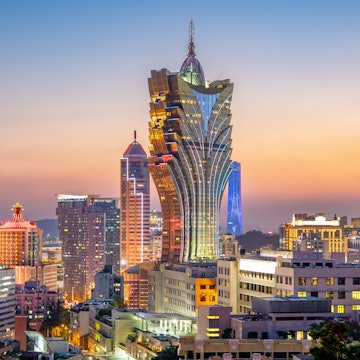 Skyscrapers of the Macau city skyline at dusk.
1151228264
aerial, architecture, asia, attractive, background, bay, beautiful, building, casino, center, china, city, cityscape, downtown, evening, famous, gate, grand, hill, horizontal, hotel, iconic, island, landmark, landscape, light, lighthouse, lisboa, macao, macau, modern, neon, night, outdoor, panorama, panoramic, sign, sky, skyline, skyscraper, structure, sunset, tour, tourism, tourist, tower, travel, twilight, urban, view