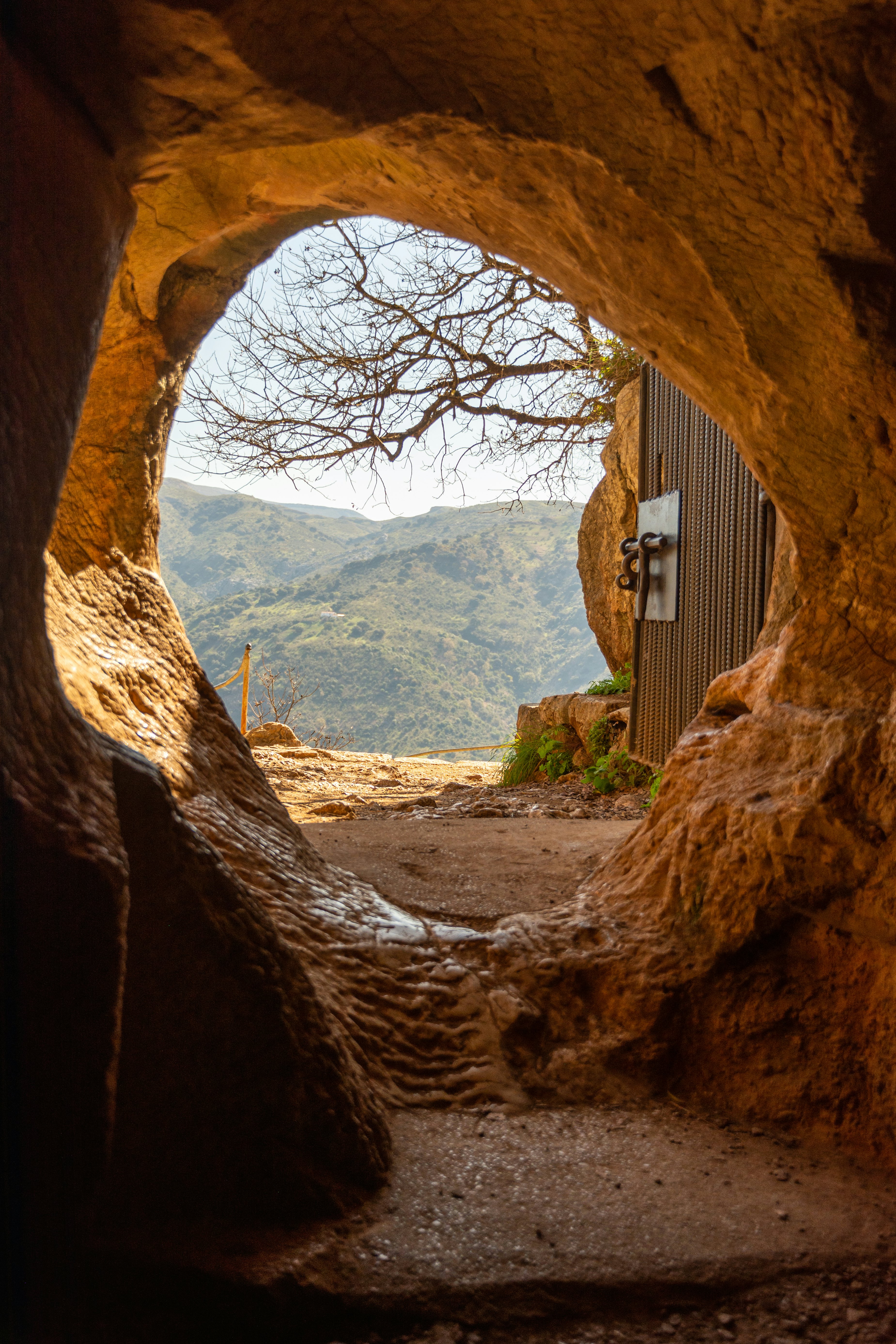 A circular hole marks the entrance to a cave.