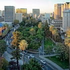An aerial and panoramic view of the historic Plaza de Cesar Chavez in San Jose, CA.
495123798
Plaza de Cesar Chavez, Building Exterior, San Jose - California, Panoramic, Aerial View, California, Sunlight, Sunrise - Dawn, Sun, Built Structure, Golden Colors, Palm Tress