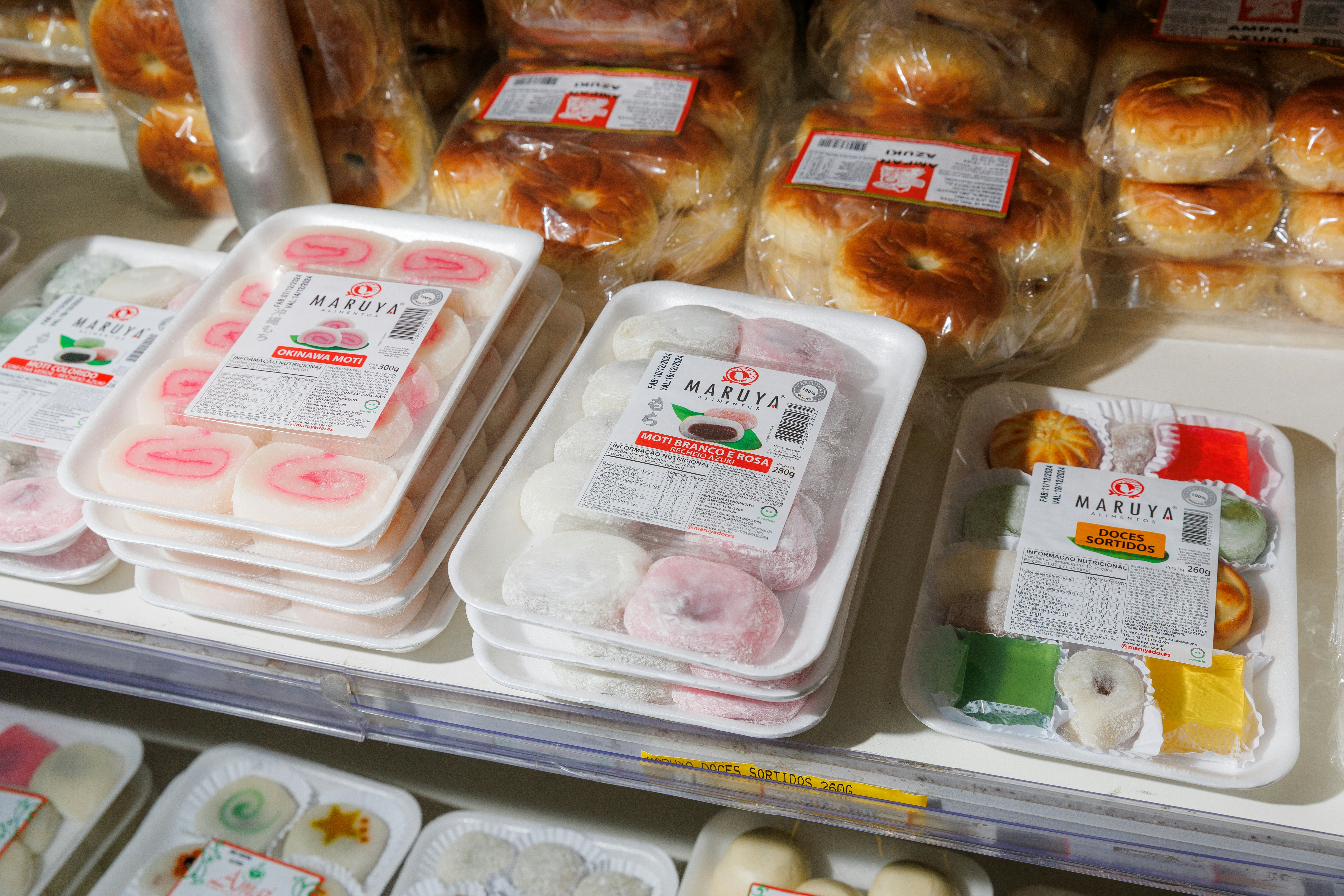 Japanese sweets and pastries on a shelf inside a Japanese supermarket