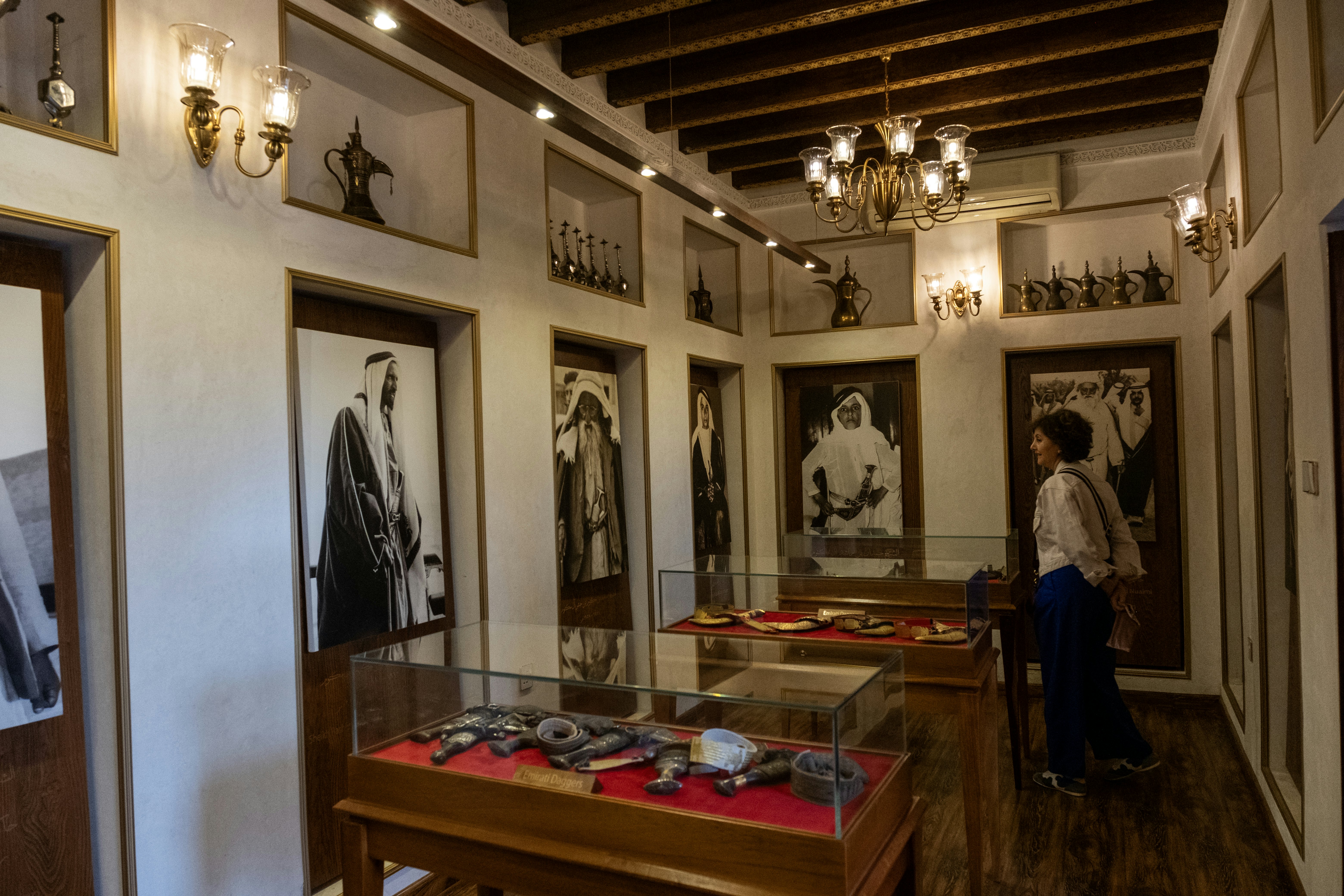 A woman looks at artifacts inside a museum