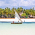 diani beach,kenya,12.02.2016: traditional dhow boat in front of coast line License Type: media Download Time: 2023-07-13T06:24:43.000Z User: mvm_lonelyplanet Is Editorial: Yes purchase_order: