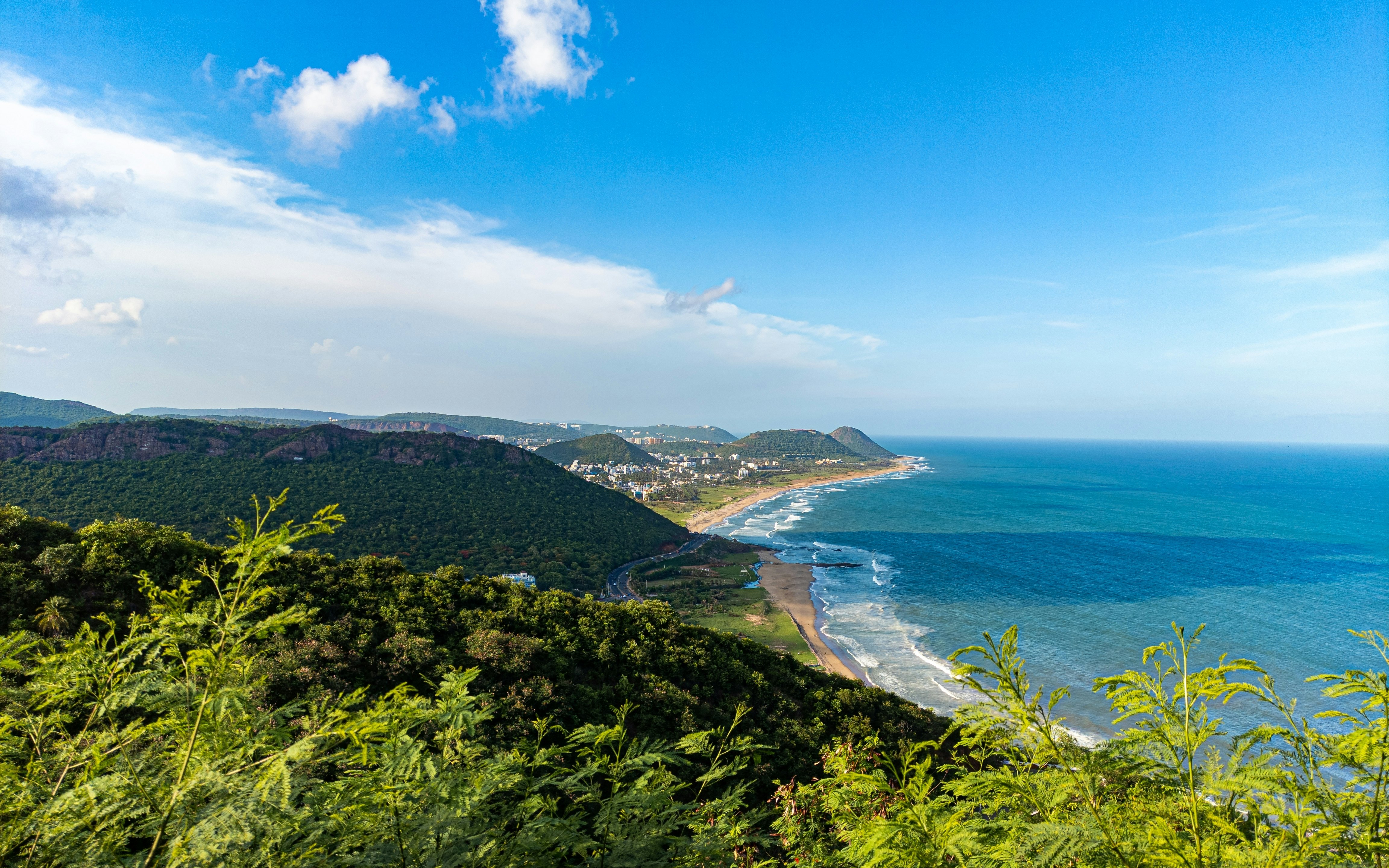 A hilltop view of hills and the coastline at Visakhapatnam.