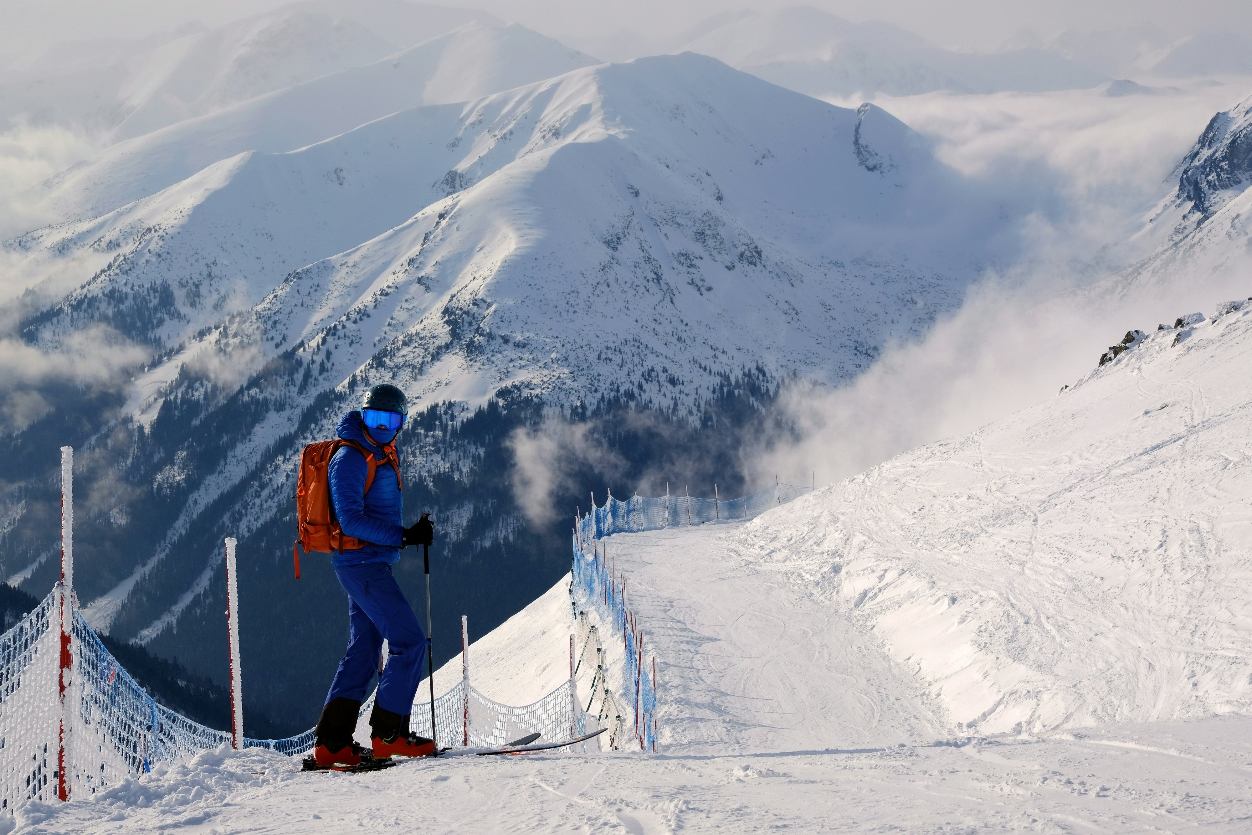 A skier on a snowy mountain.