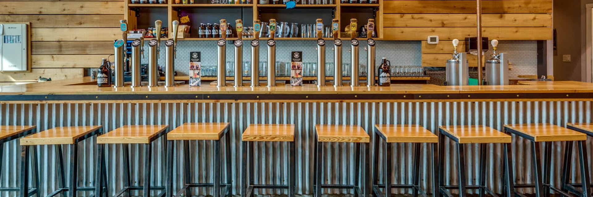 The tasting room at Whistler Brewing Company in Whistler, British Columbia, features a long bar with local spirits on tap.