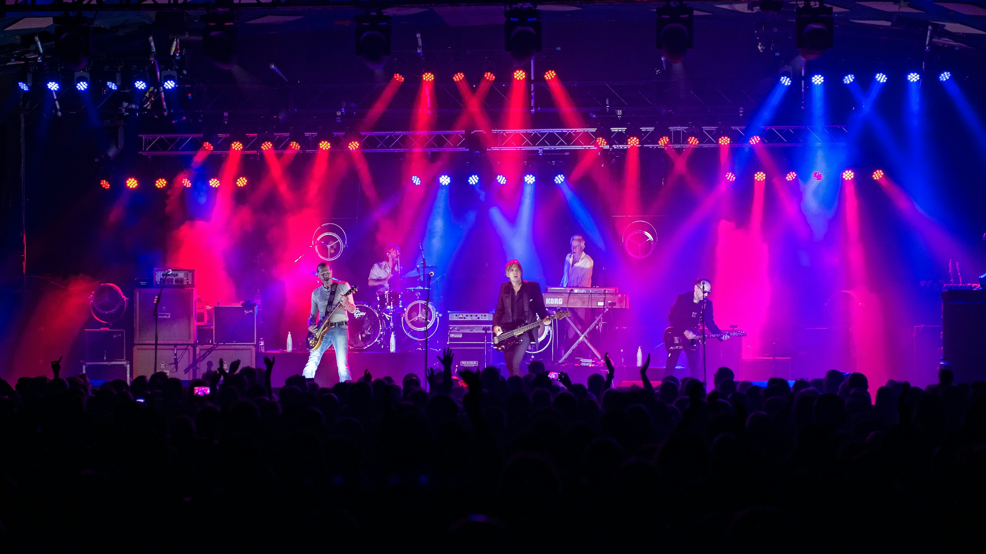 A band in concert at a venue in Glasgow, Scotland.
