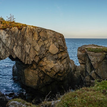 Berry Head Arch rock formation on the East Coast Trail hiking trail in Newfoundland, East Canada., License Type: media, Download Time: 2025-07-22T19:28:44.000Z, User: lonelyplanetmedia, Editorial: false, purchase_order: 56500 - T&R or Kids, job: Global Publishing WIP , client: WTGWH , other: Pia Peterson Haggarty