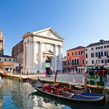 Venice, Italy - December 29, 2018: Campo San Barnaba and its church with a typical venetian gondola and tourists, License Type: media, Download Time: 2025-07-01T20:30:48.000Z, User: lonelyplanetmedia, Editorial: true, purchase_order: 65050 - Digital Destinations and Articles, job: Global Publishing WIP, client: App, other: Pia Peterson Haggarty