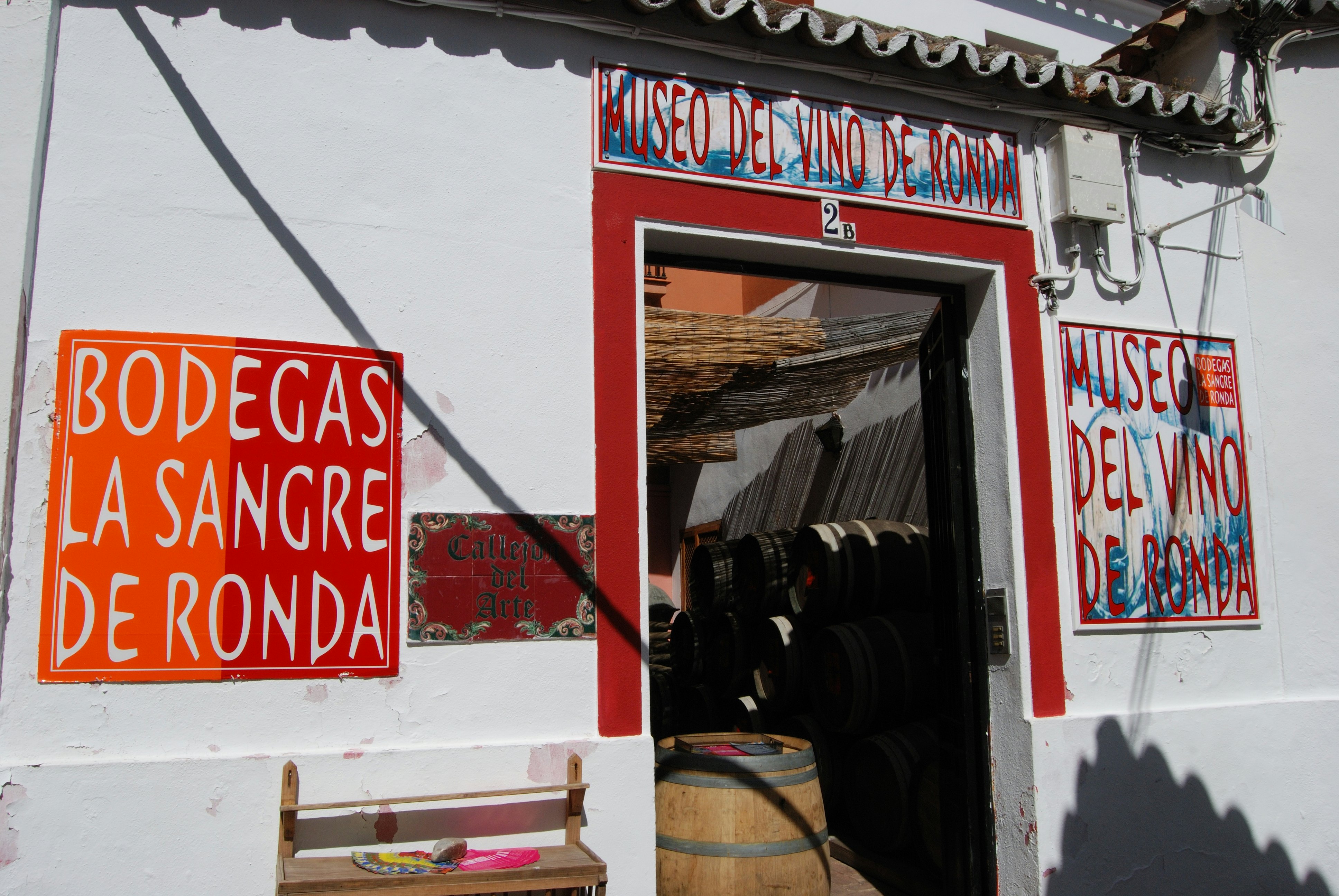 Entrance to a wine museum with a large sherry barrel in the doorway.