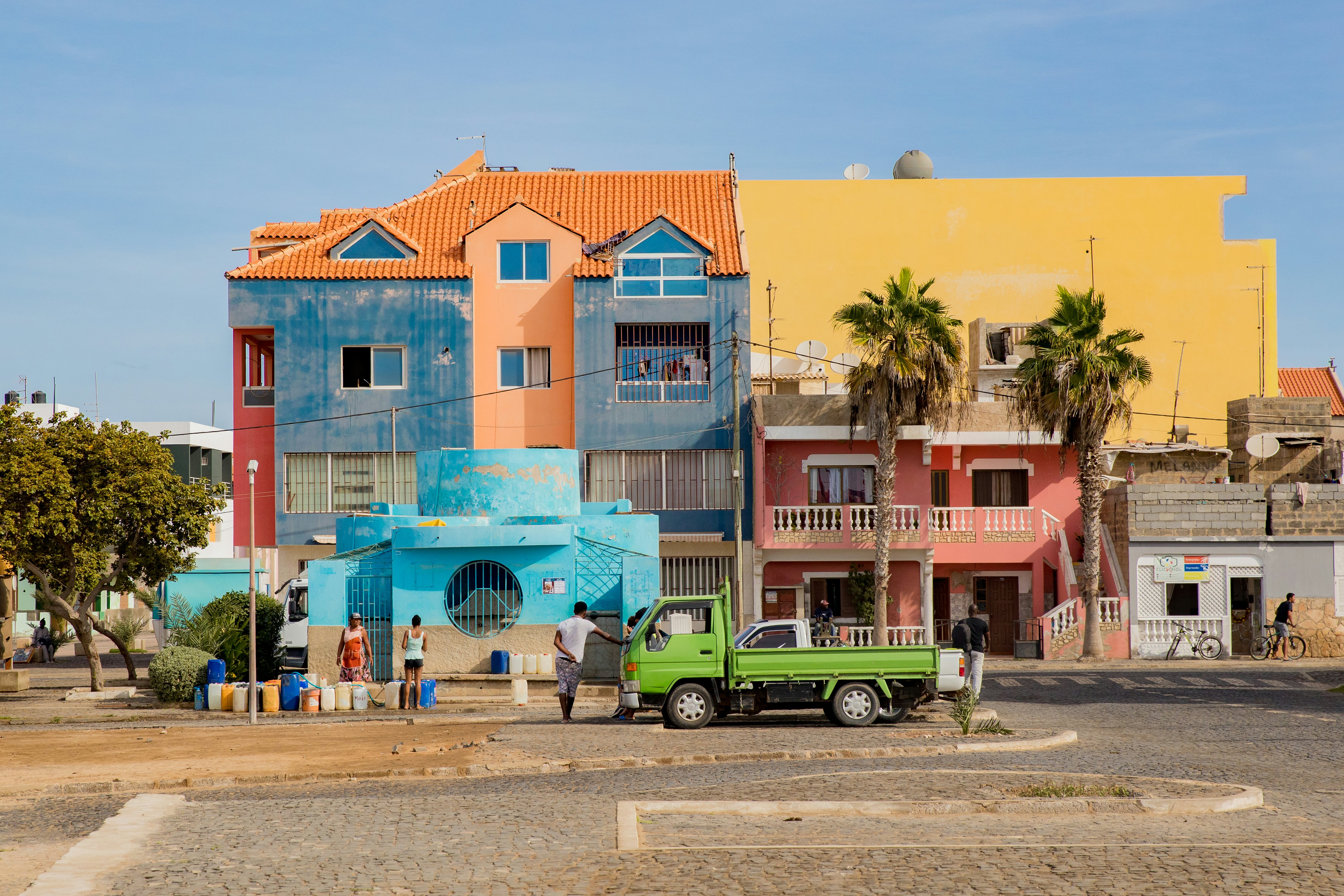 Pastel-colored buildings in a town center.