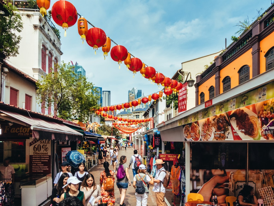 Singapore, Singapore - August 05, 2018: Tourists strolling around the various souvenir market stalls in Singapore Chinatown in Southeast Asia., License Type: media, Download Time: 2025-06-26T15:23:03.000Z, User: rhylton_redventures, Editorial: true, purchase_order: 65050 - Digital Destinations and Articles, job: Lonely Planet, client: wip, other: Rhianydd Hylton