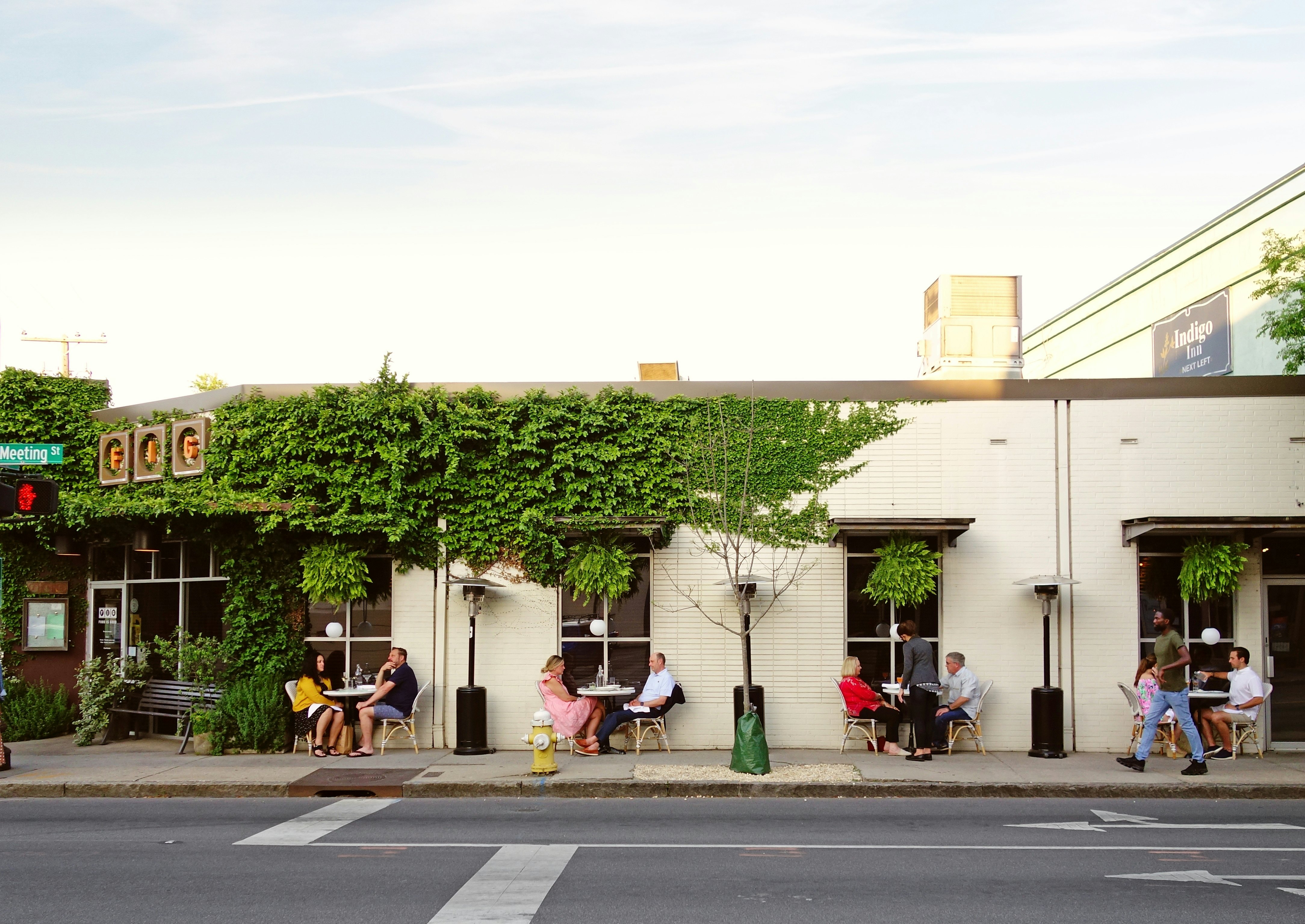 People dining outdoors at FIG Restaurant in historic Charleston South Carolina