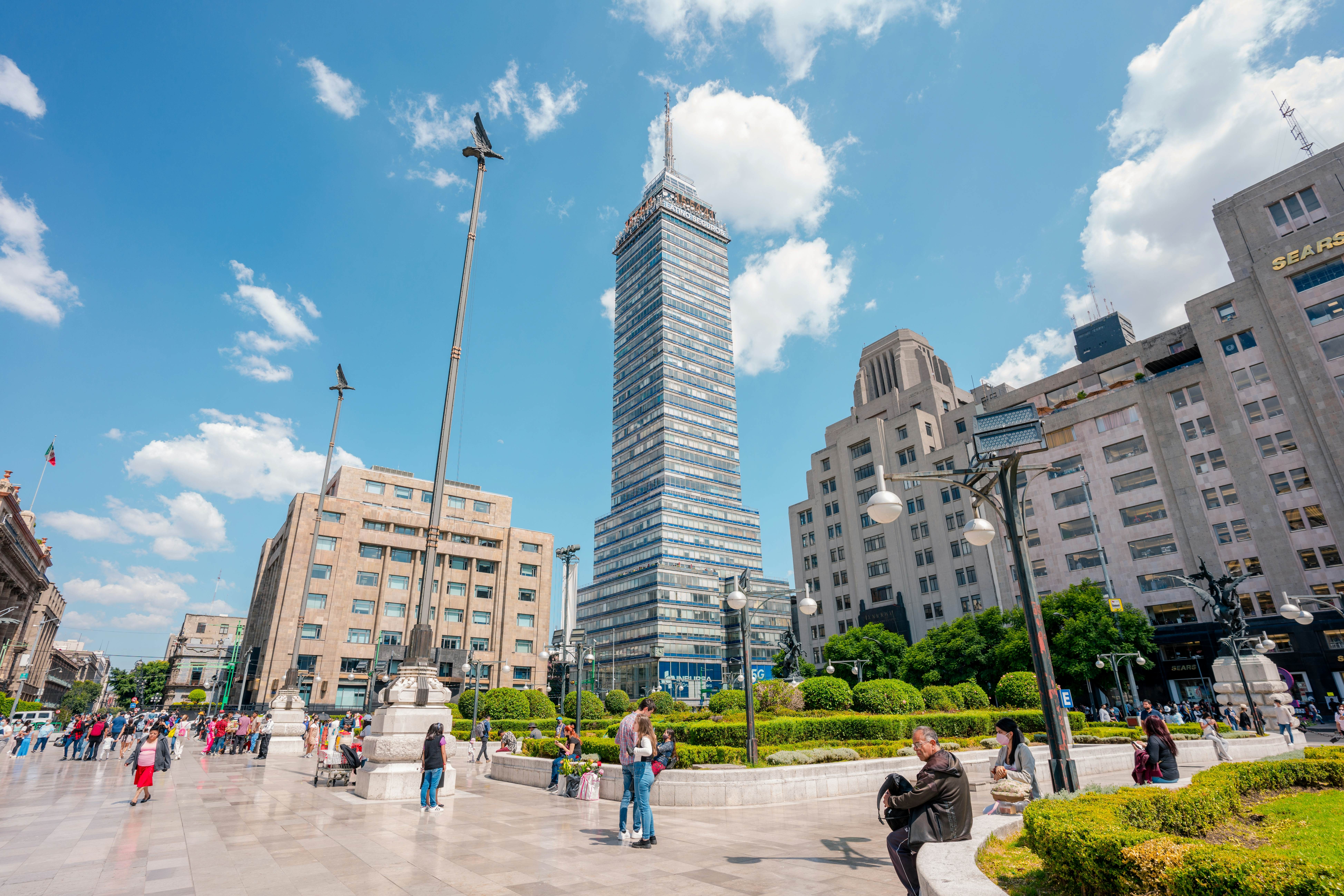 Mexico City, Mexico; August 06 2022: view to the latin tower from the esplanade of fine arts, under blue sky., License Type: media, Download Time: 2025-05-20T22:41:32.000Z, User: mvm_lonelyplanet, Editorial: true, purchase_order: 56530 - Guidebooks, job: Global Publishing, client: Mexico city sheetmap_2025, other: María Virginia Moreno