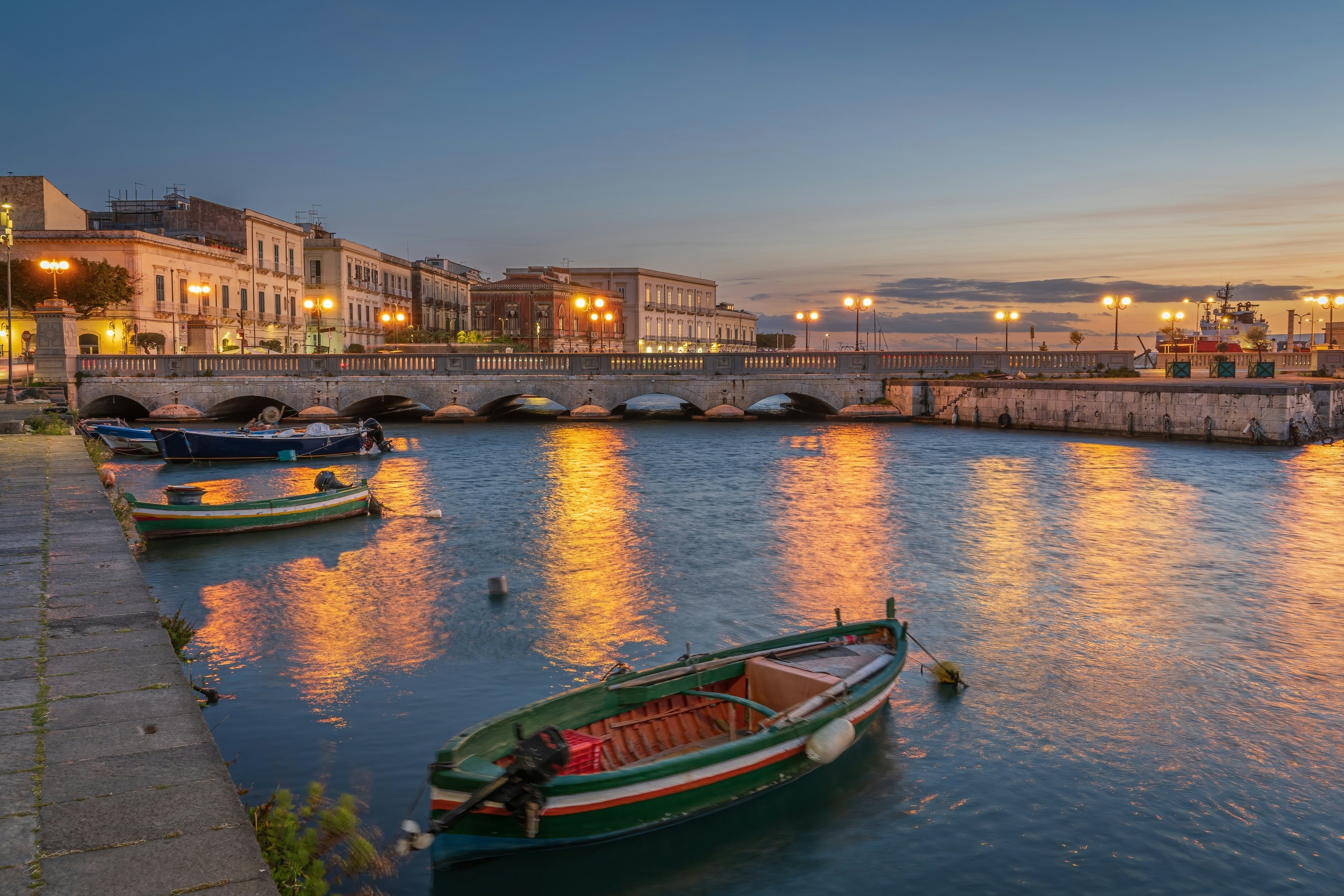 Sunset over the harbor in Ortygia.