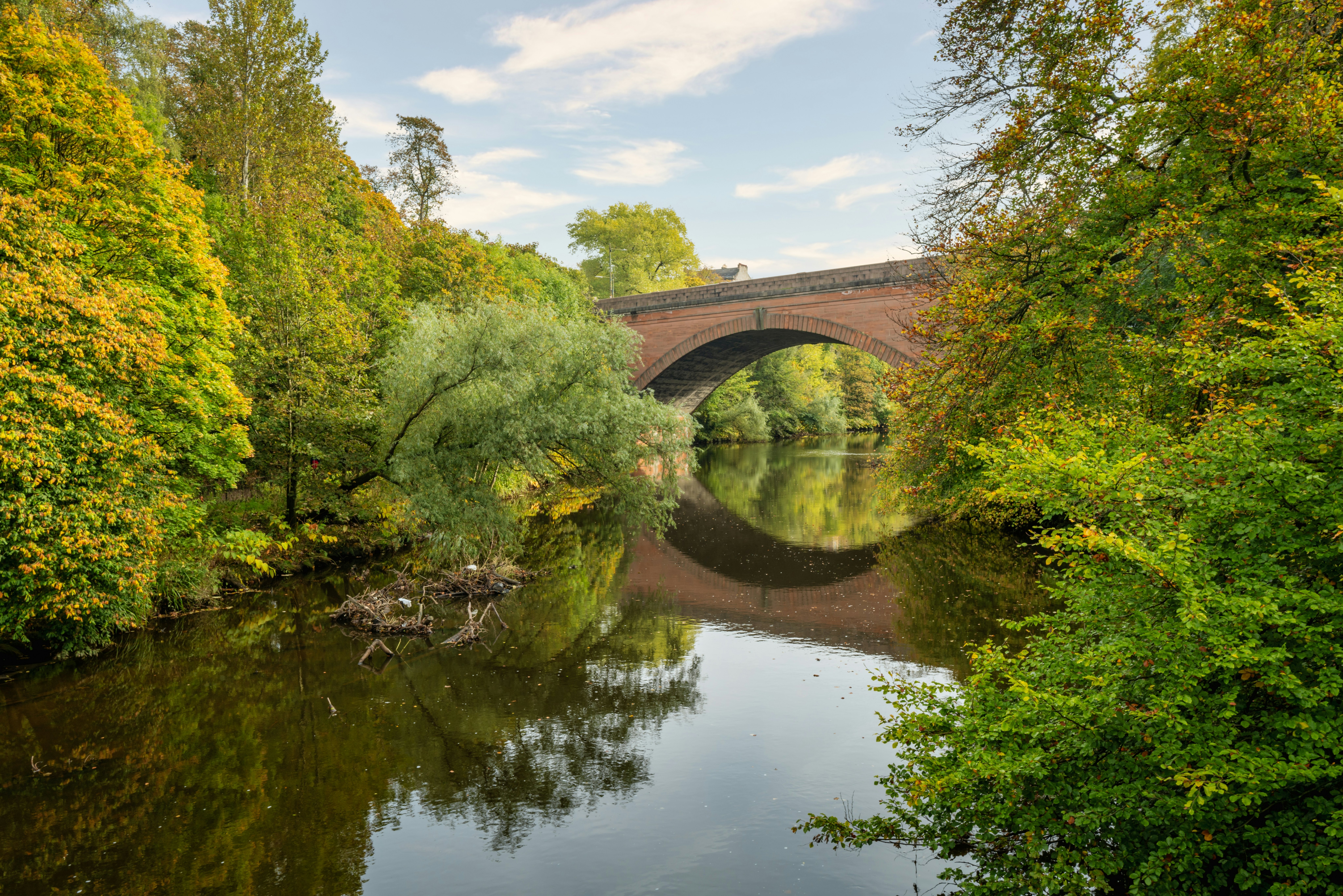Autumn view of a bridge over the River Kelvin in Glasgow, Scotland.