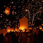 Chiang Mai - Thailand November 27, 2023 : Tourists happily celebrate releasing lanterns at the Loi Krathong Yi Peng Lantern Festival according to Thai cultural traditions., License Type: media, Download Time: 2025-04-16T00:08:25.000Z, User: claramonitto, Editorial: true, purchase_order: 56530 - Guidebooks, job: Global Publishing-WIP, client: Southeast Asia 20, other: Clara Monitto