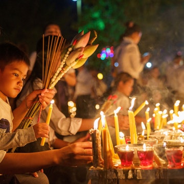 PHNOM PENH, KH - Feb 19, 2019: A mother and daughter celebrating Cambodia's Pchum Ben festival with lighting candles, License Type: media, Download Time: 2025-09-28T14:59:30.000Z, User: LP_KBaxter, Editorial: true, purchase_order: 65050 - Digital Destinations and Articles, job: lonely planet, client: The best times to visit Cambodia, other: Kathleen Baxter