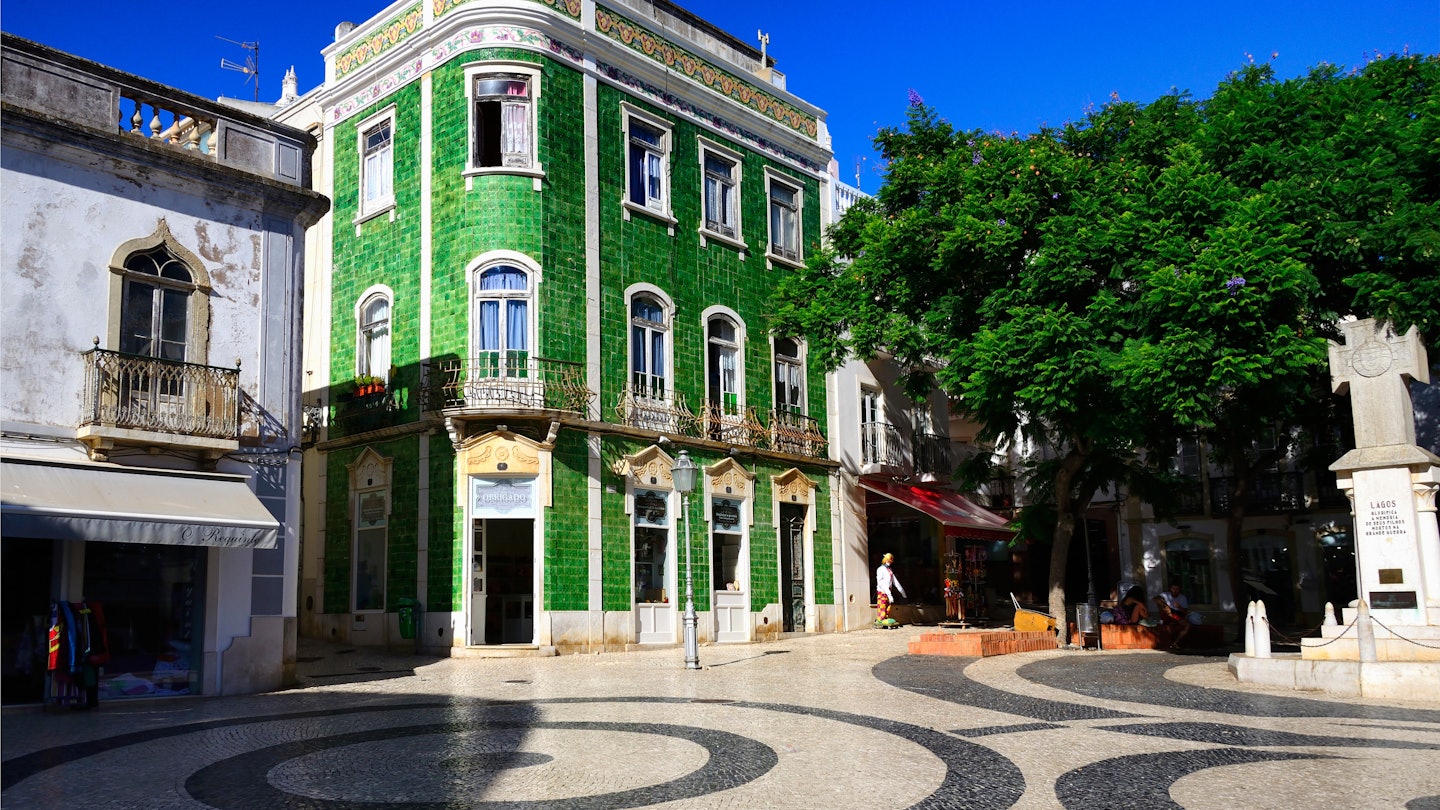 Lagos, Faro district, Algarve, Portugal, Europe - 05.09.2017 : Calçada portuguesa - paving in geometric patterns, green azulejos house, historic part of the city portuguesa, Praça Luis de Camoes; Shutterstock ID 2495871615; purchase_order:65050 - Digital Destinations and Articles; job:Lonely Planet Online Editorial; client:Best things to do in Lagos, Portugal; other:Brian Healy
2495871615