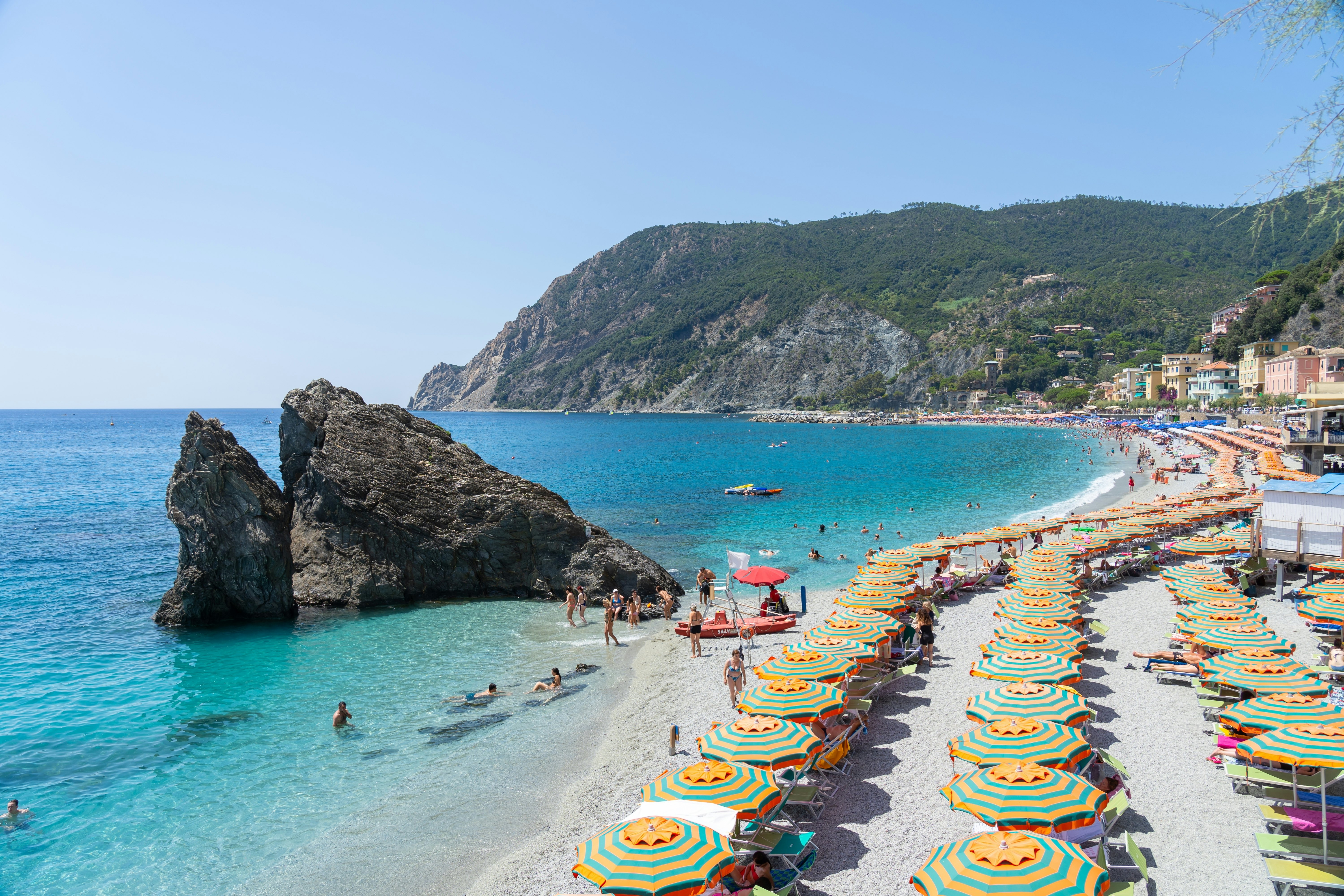 View of umbrellas on the beach at Monterosso al Mare, Cinque Terre, Italy.