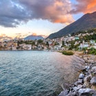 San Pedro La Laguna town surrounded by volcanoes on Lake Atitlan, Guatemala, on dramatic sunset, License Type: media, Download Time: 2025-05-17T15:20:22.000Z, User: nic.dhoedt_lonelyplanet, Editorial: false, purchase_order: 56530 - Guidebooks, job: Global Publishing WIP, client: Lonely Planet Central America 11, other: Nicolas D'Hoedt