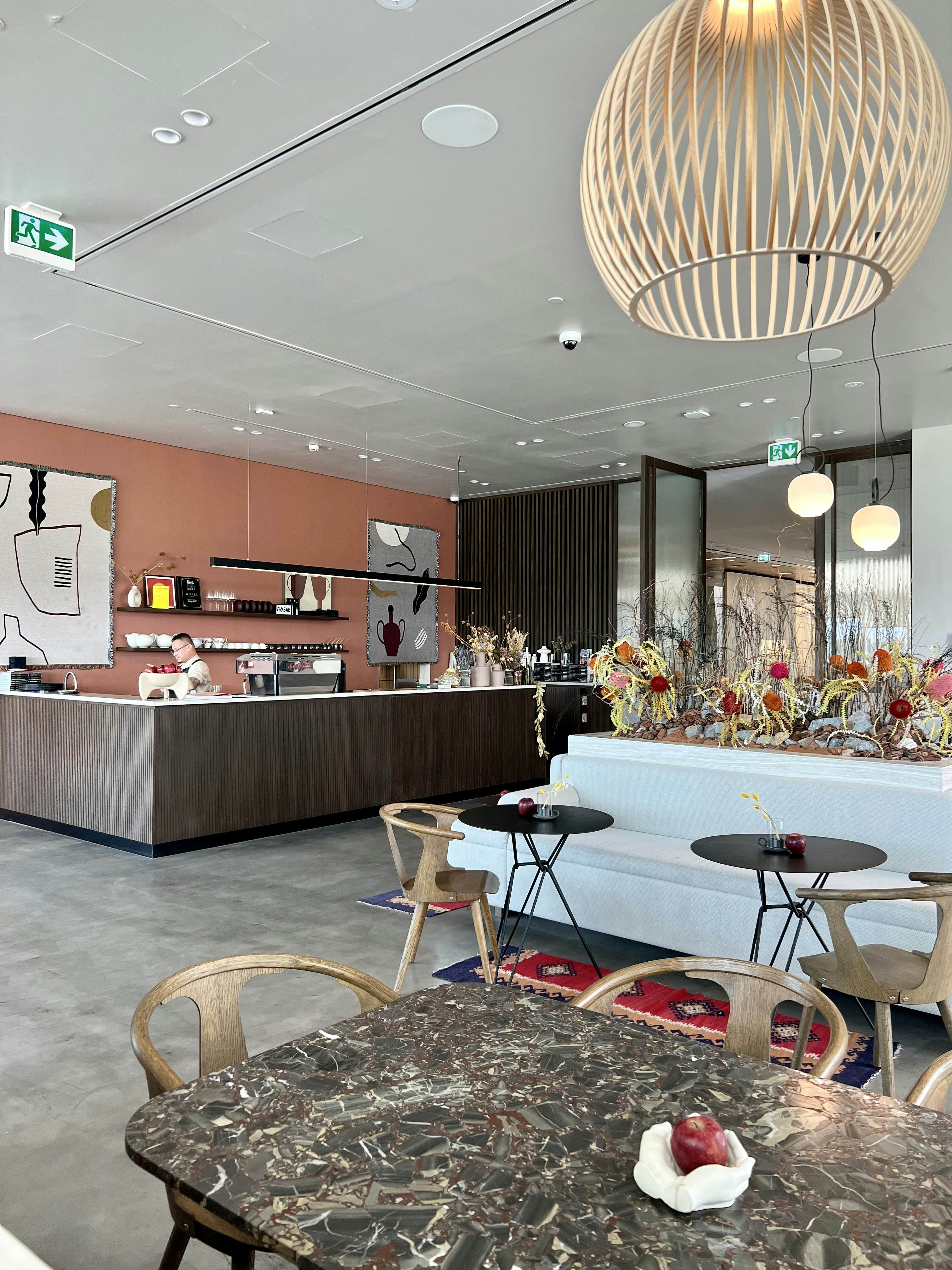 Man serving behind the counter of a cafe