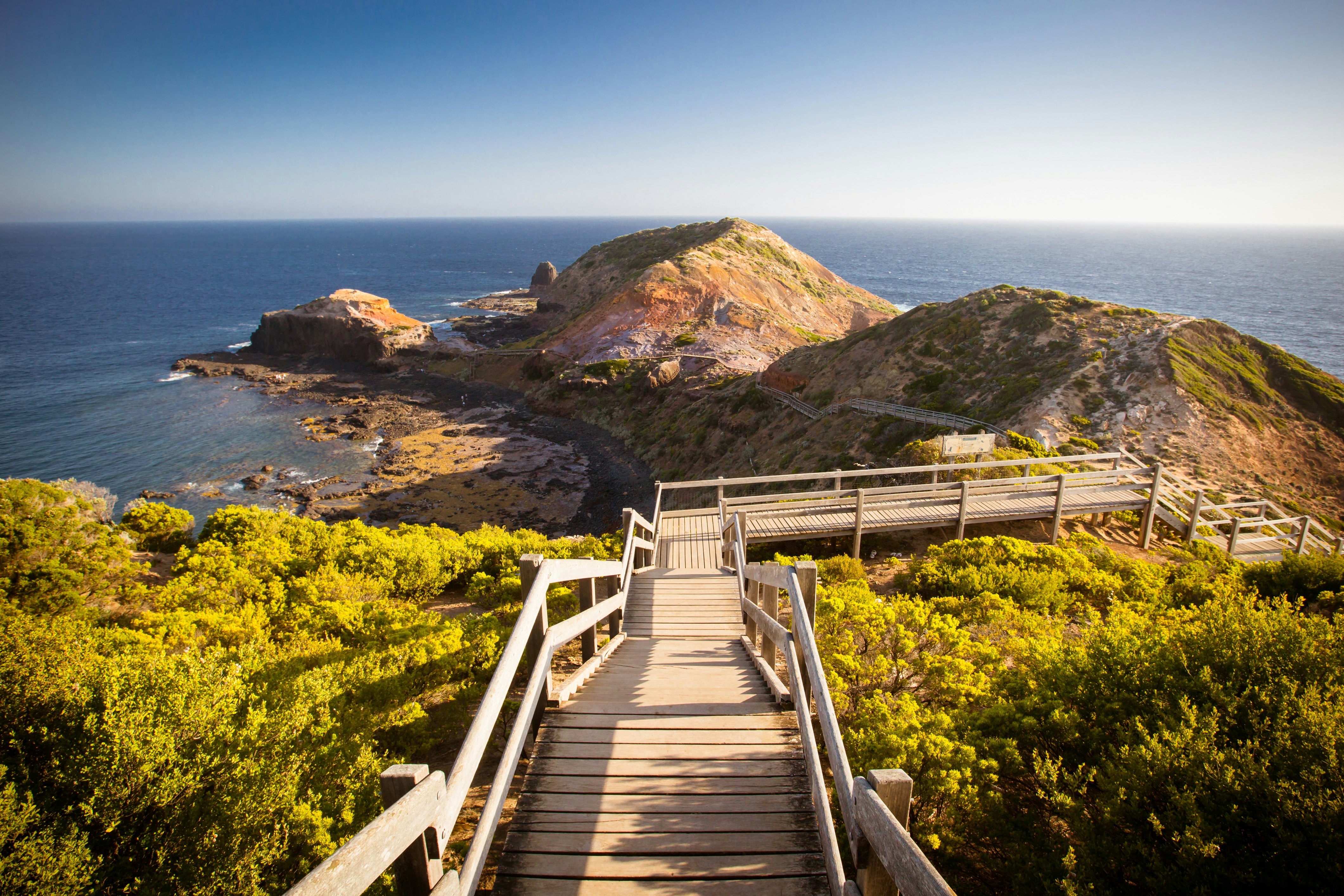 The famous Cape Schanck boardwalk runs towards the sea and rock formation known as London Bridge, in Victora. Australia