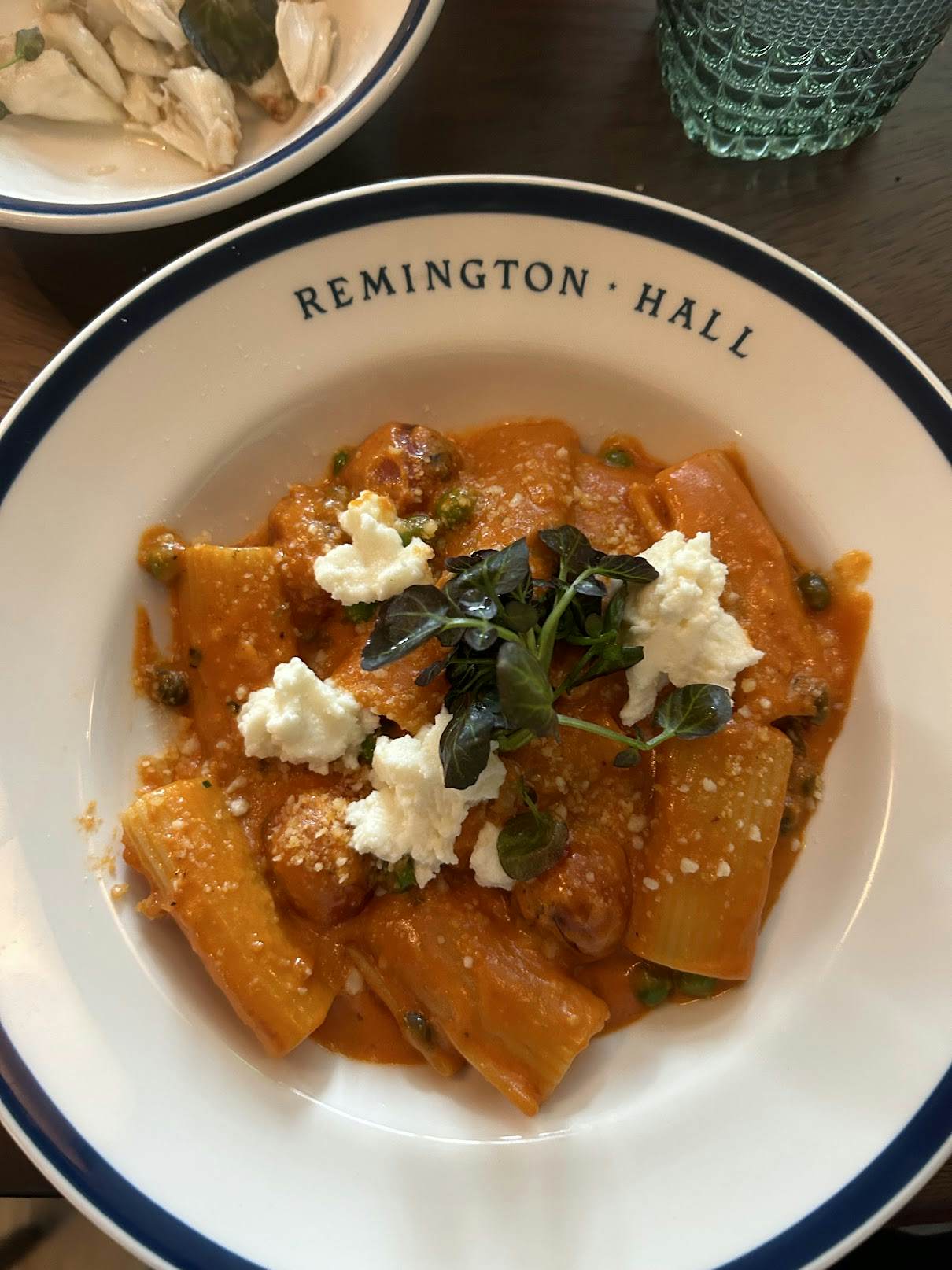 A bowl of pasta with cheese. 