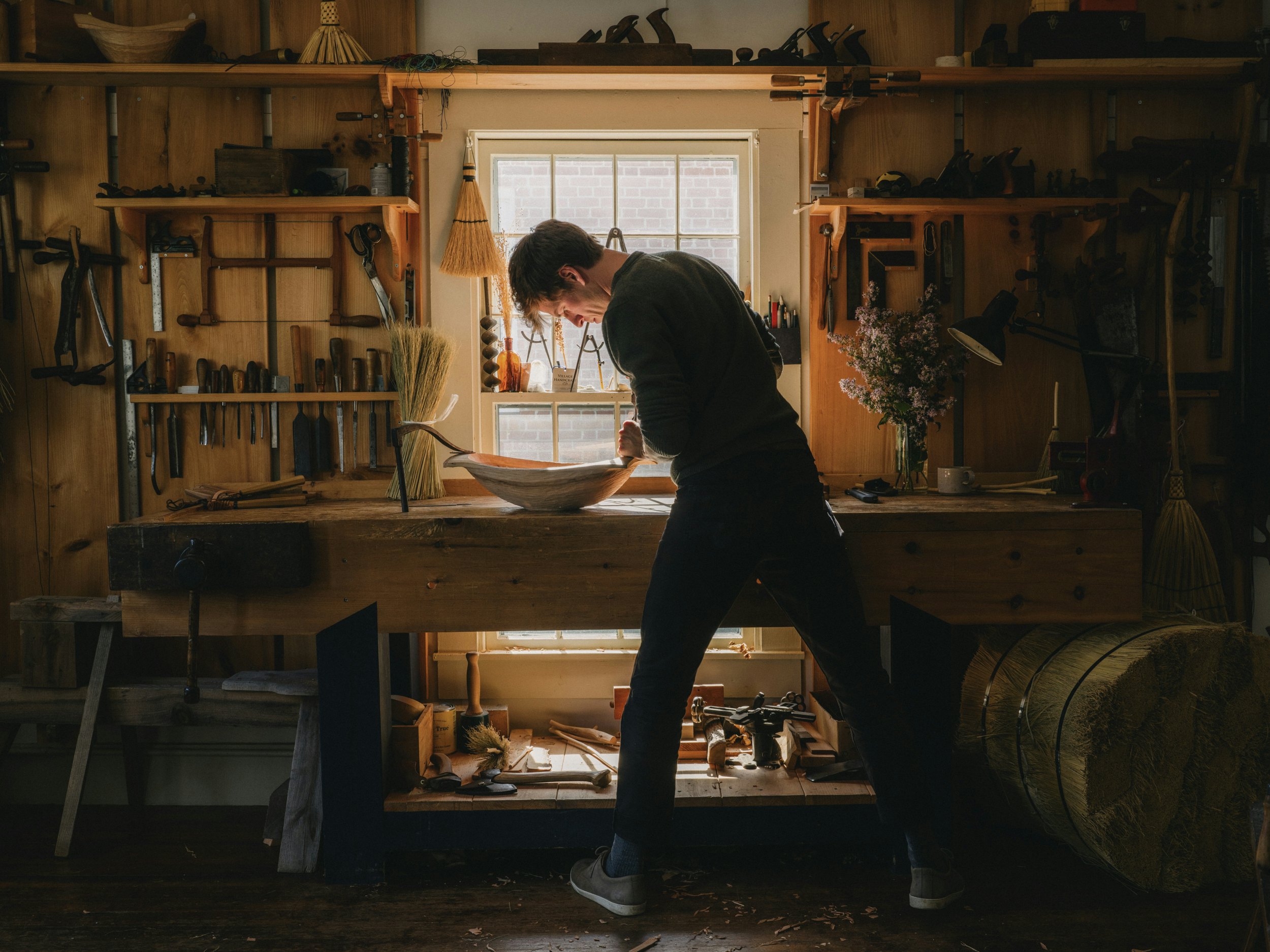 Eric, the owner of Village Handcraft, working on pieces for the store