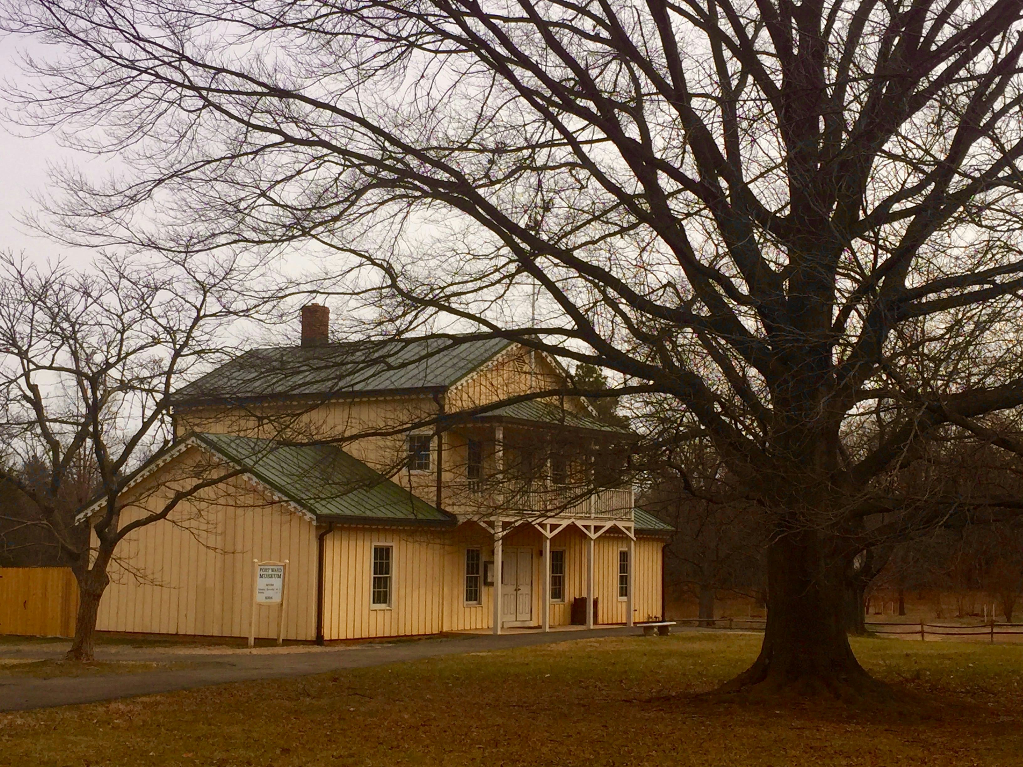 Fort Ward Museum, a small tan-colored building with a dark green roof