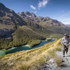 Lonely Planet Traveller Magazine, Issue 71, New Zealand, South Island, Routeburn Track, walking, hiking
A walker on the Routeburn Track rising high above Lake Mackenzie.