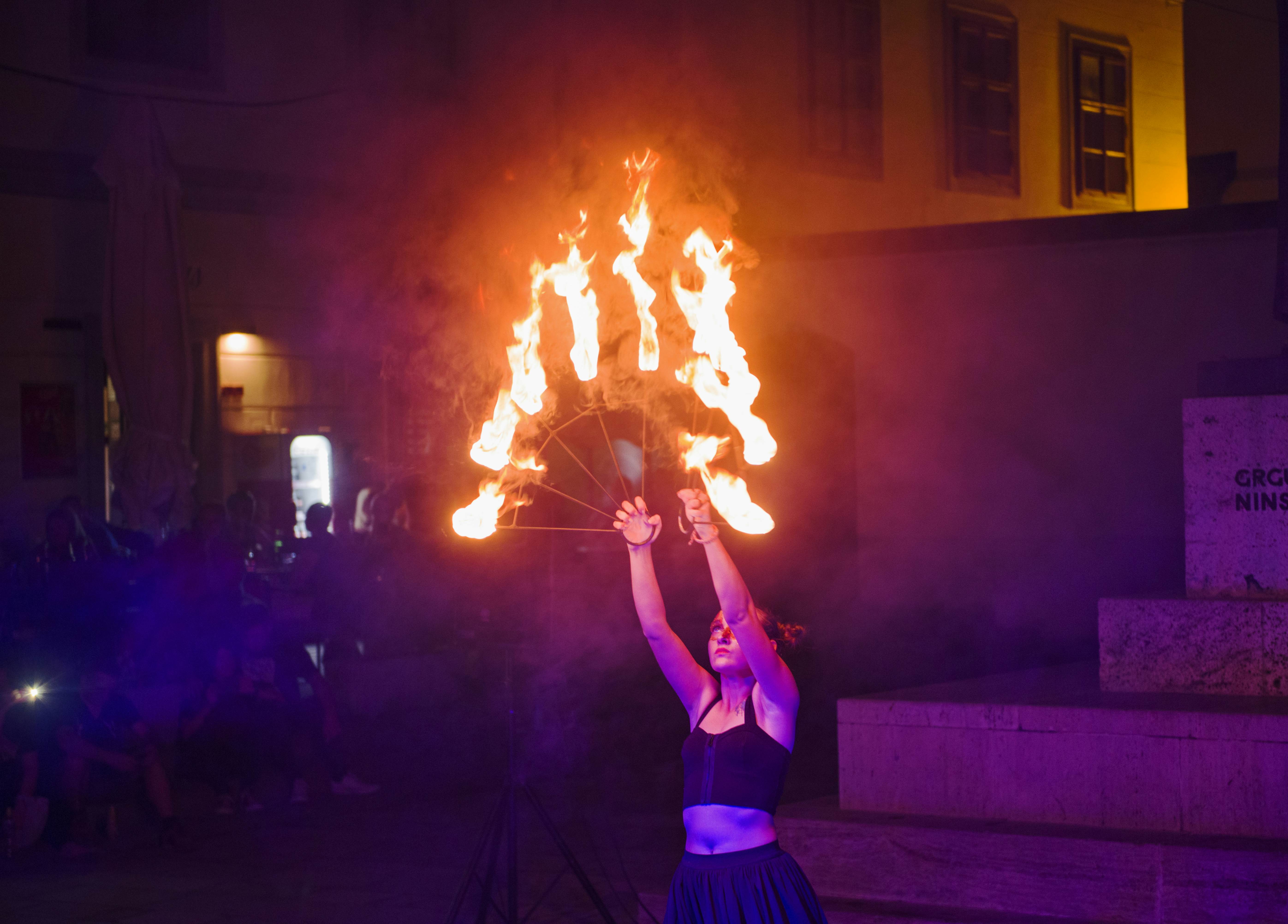 A person holds flaming sticks during a festival in Varaždin, Croatia.