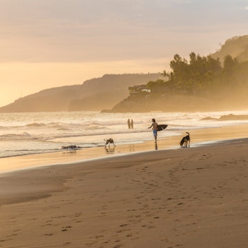 El Zonte, El Salvador. February 2018. A view of a surfer on the beach in El Zonte in El Salvador. License Type: media Download Time: 2024-01-10T21:16:37.000Z User: bhealy950 Is Editorial: Yes purchase_order: